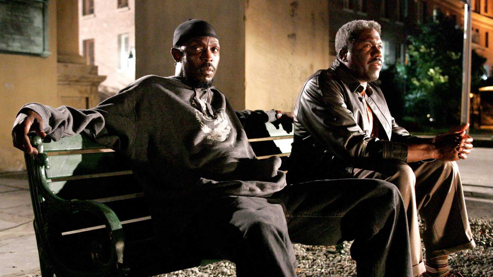 Omar sits on a bench in The Wire