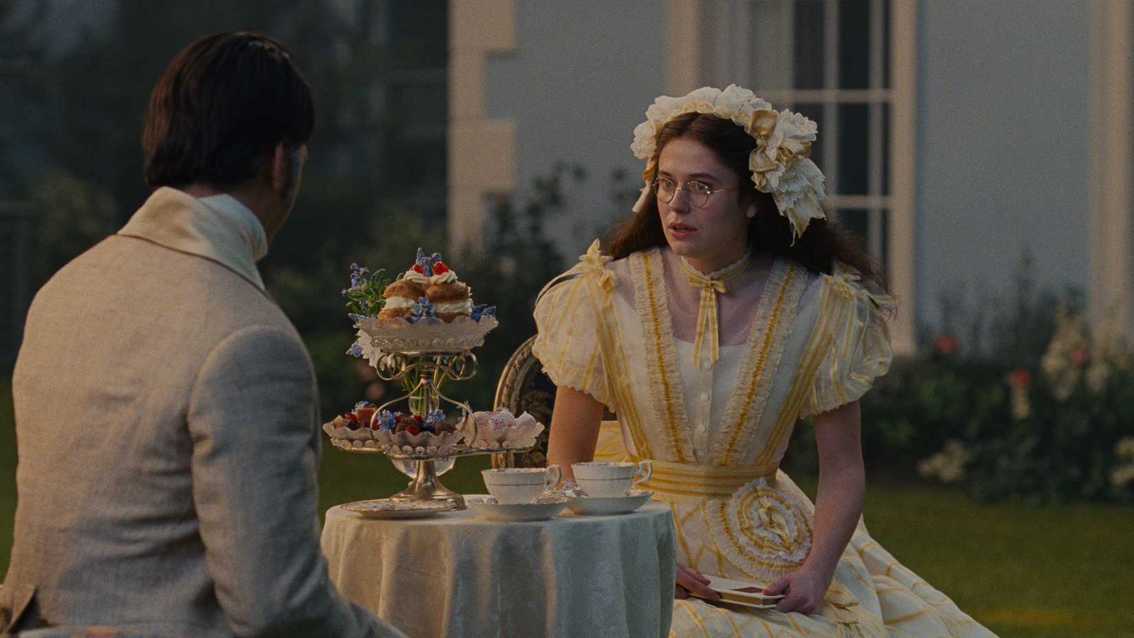 Edgar and Isabella having tea while sitting in their garden and chatting in Wuthering Heights.