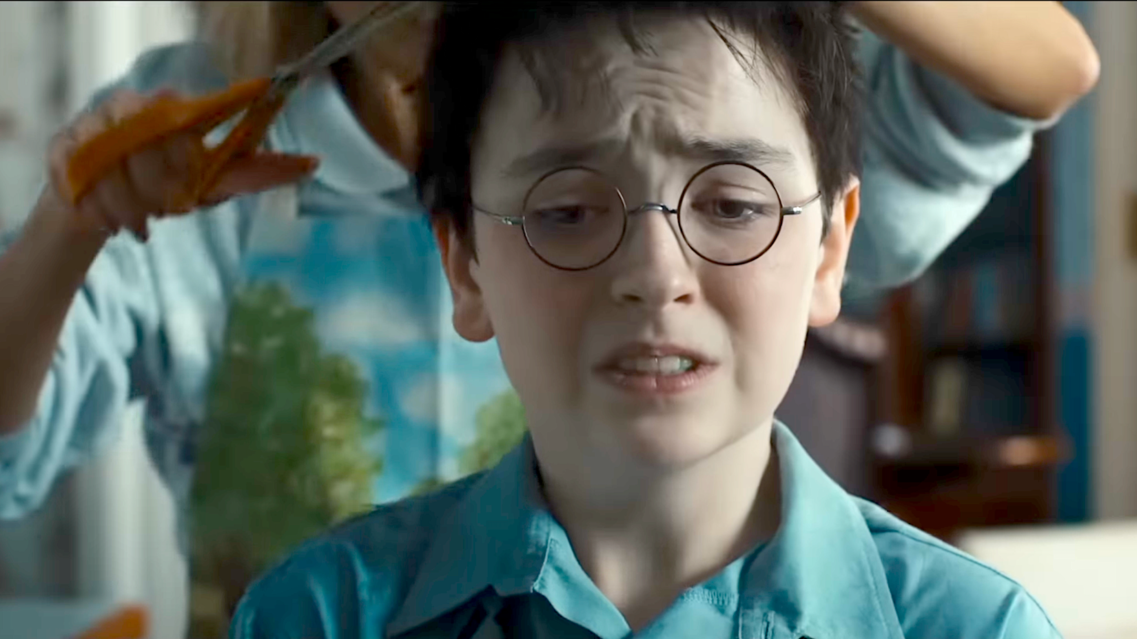 Harry getting a haircut from Aunt Petunia in HBO's 'Harry Potter'