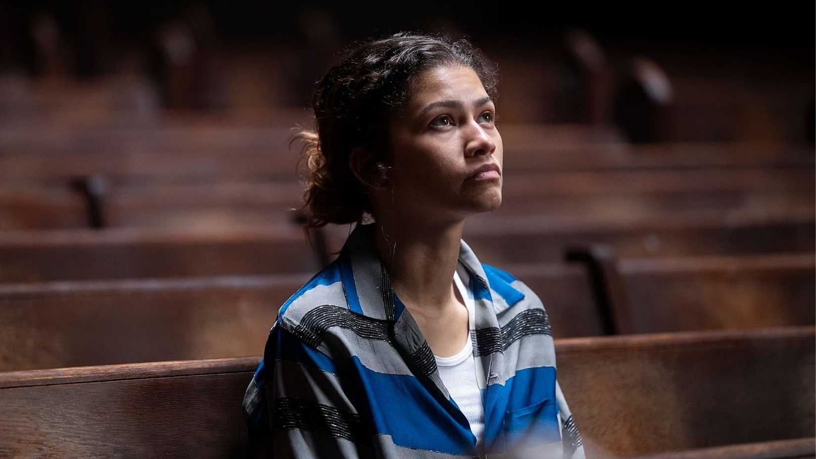 Zendaya sitting in a church pew in The Drama