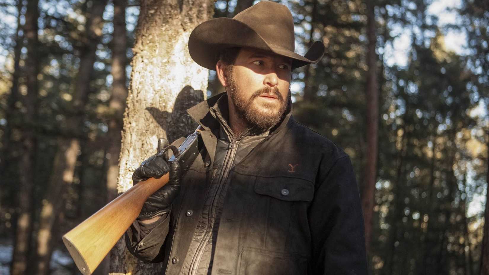 Rip Wheeler holding a gun in Yellowstone