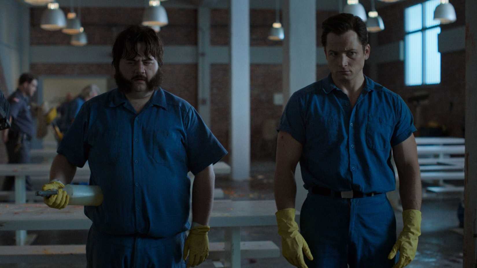 Paul Walter Hauser and Taron Egerton in "Black Bird."