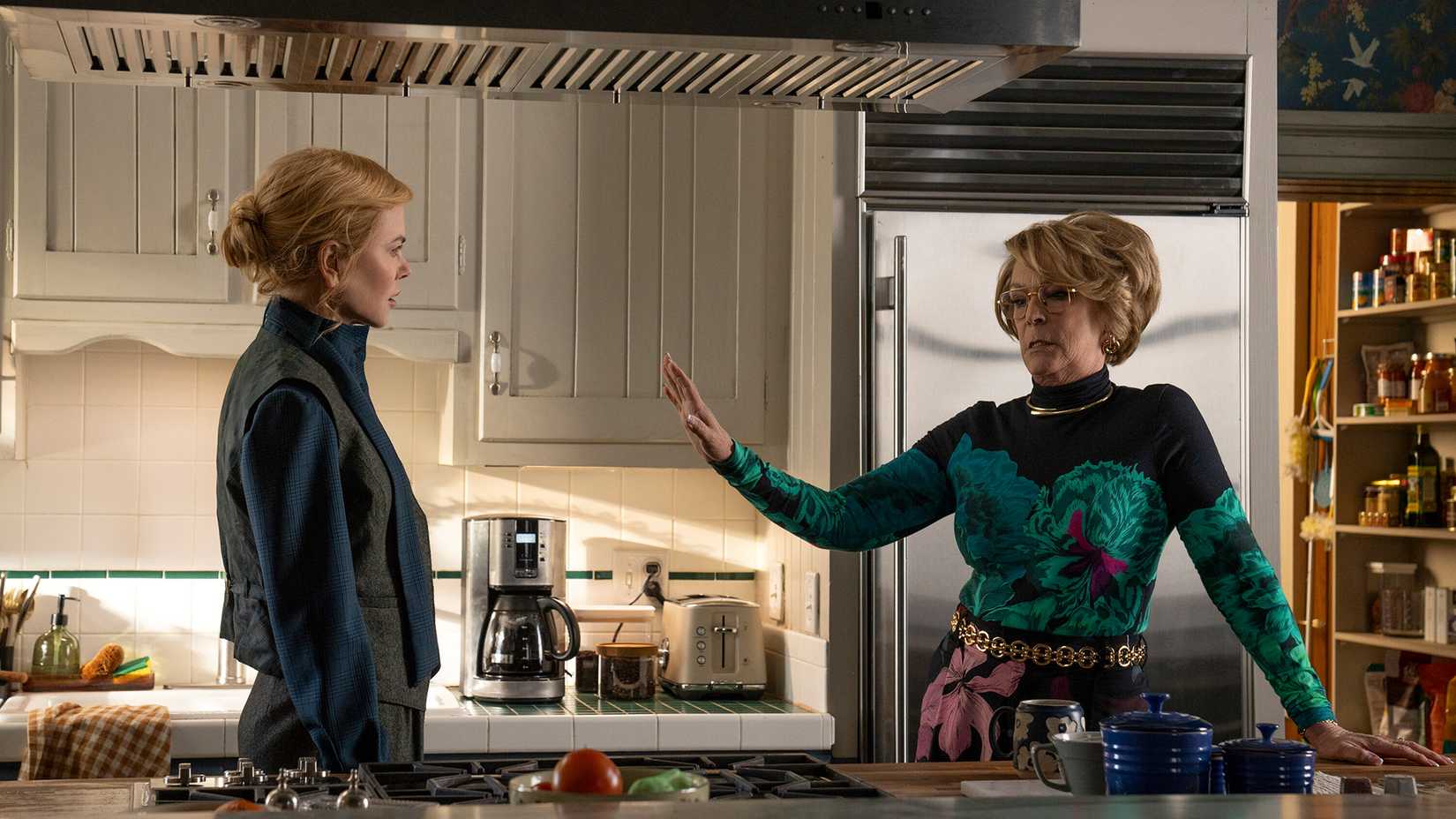 Kay talking to Dorothy in the kitchen, who has her hand up in Scarpetta.