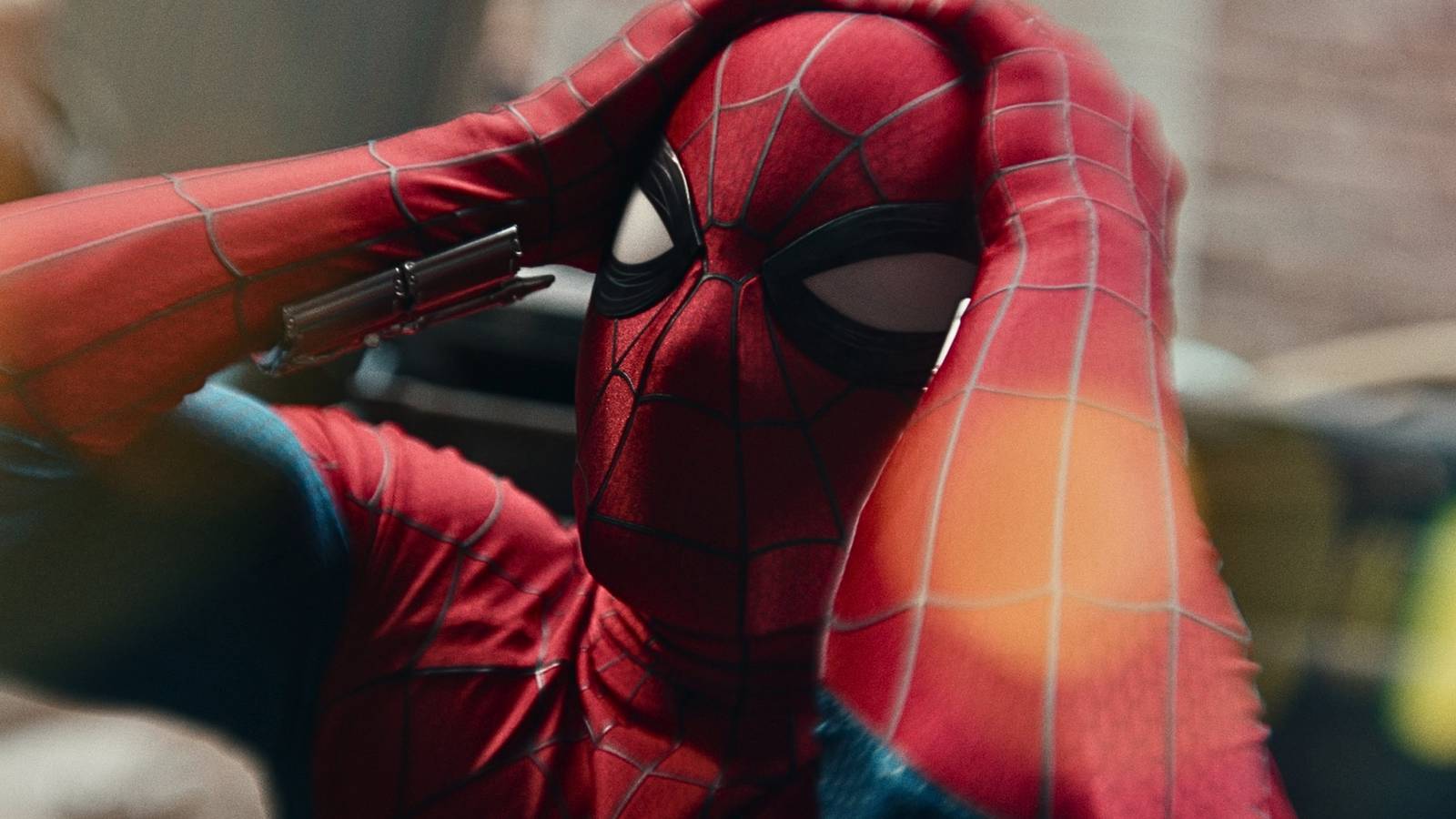 Spider-Man holding his head