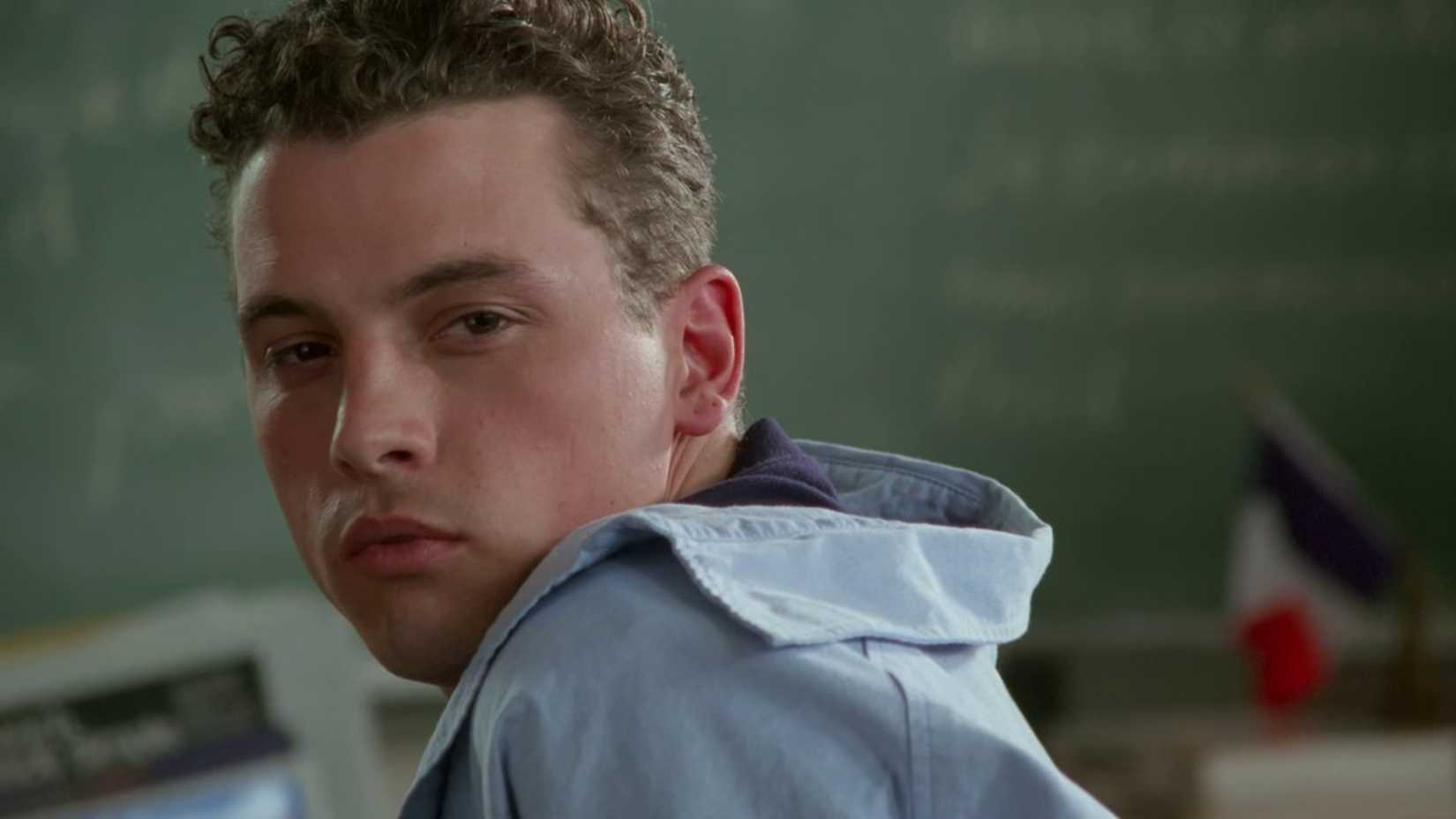 Chris sits in class in The Craft