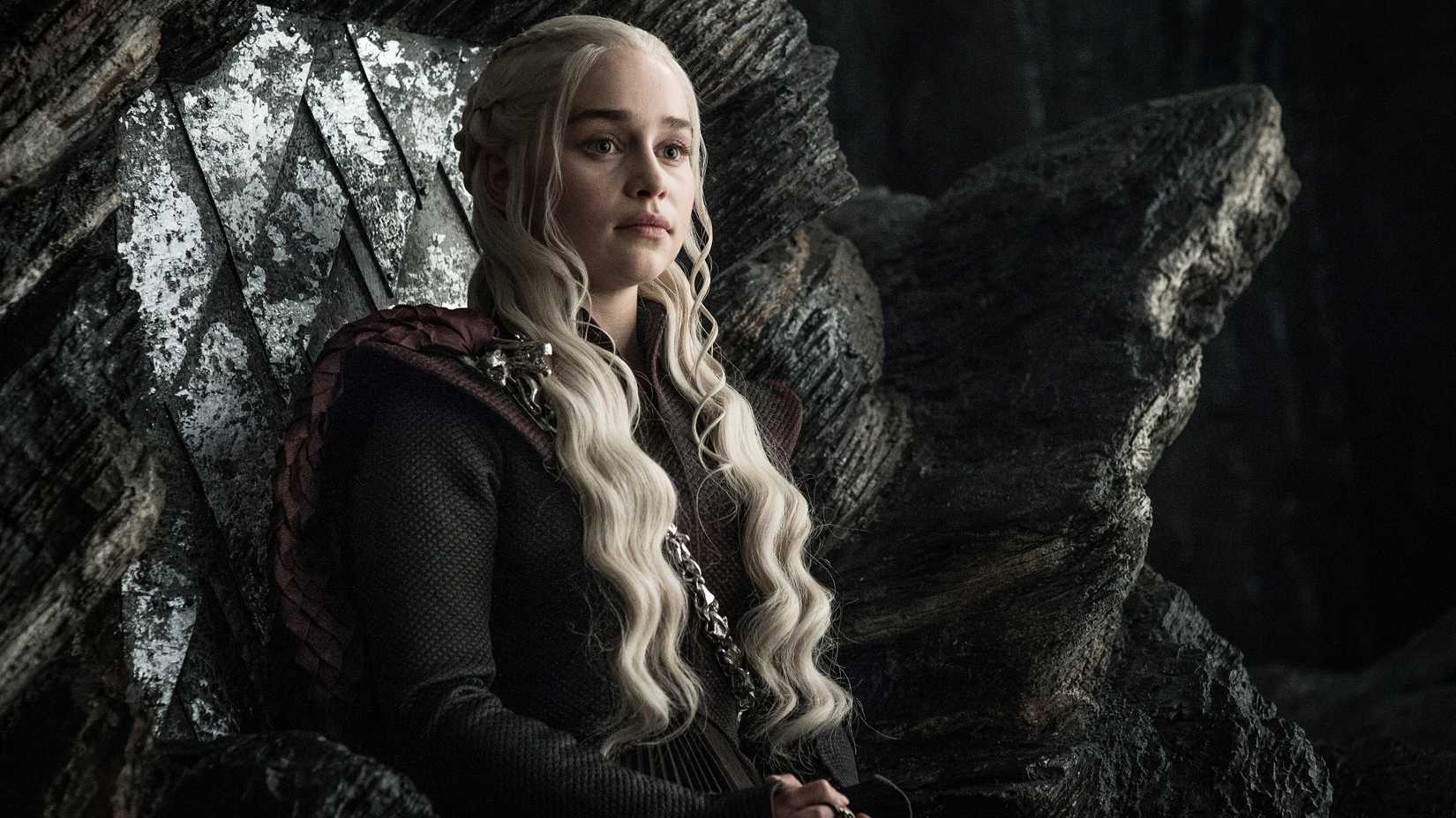 Daenerys sits on a throne in Game of Thrones