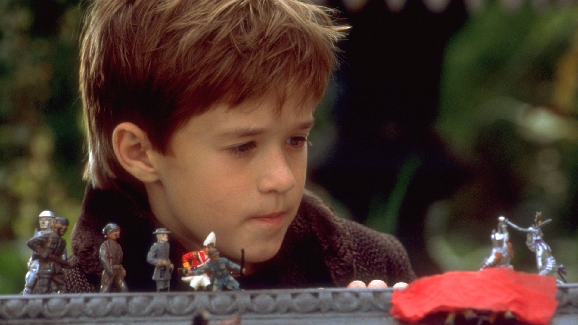 Haley Joel Osment em O Sexto Sentido, filme que o consagrou após Forrest Gump.