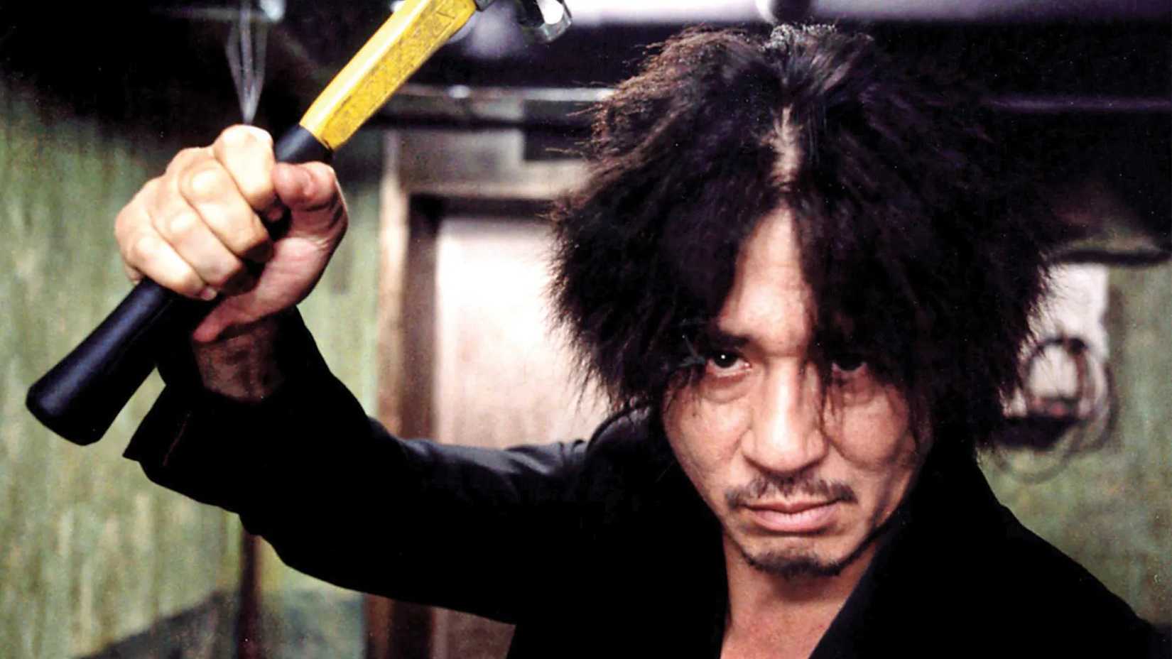 Oh Dae-su with a hammer in the hallway fight of Oldboy (2003)