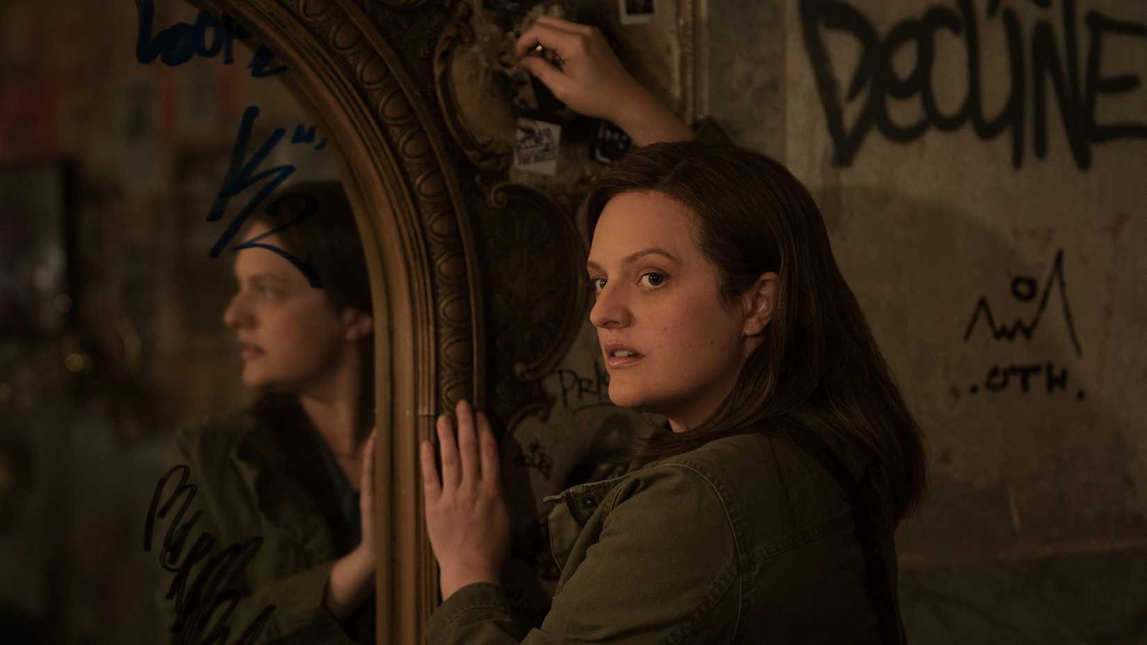 Elisabeth Moss as Kirby Mazrachi investigating an abandoned house in Shining Girls.