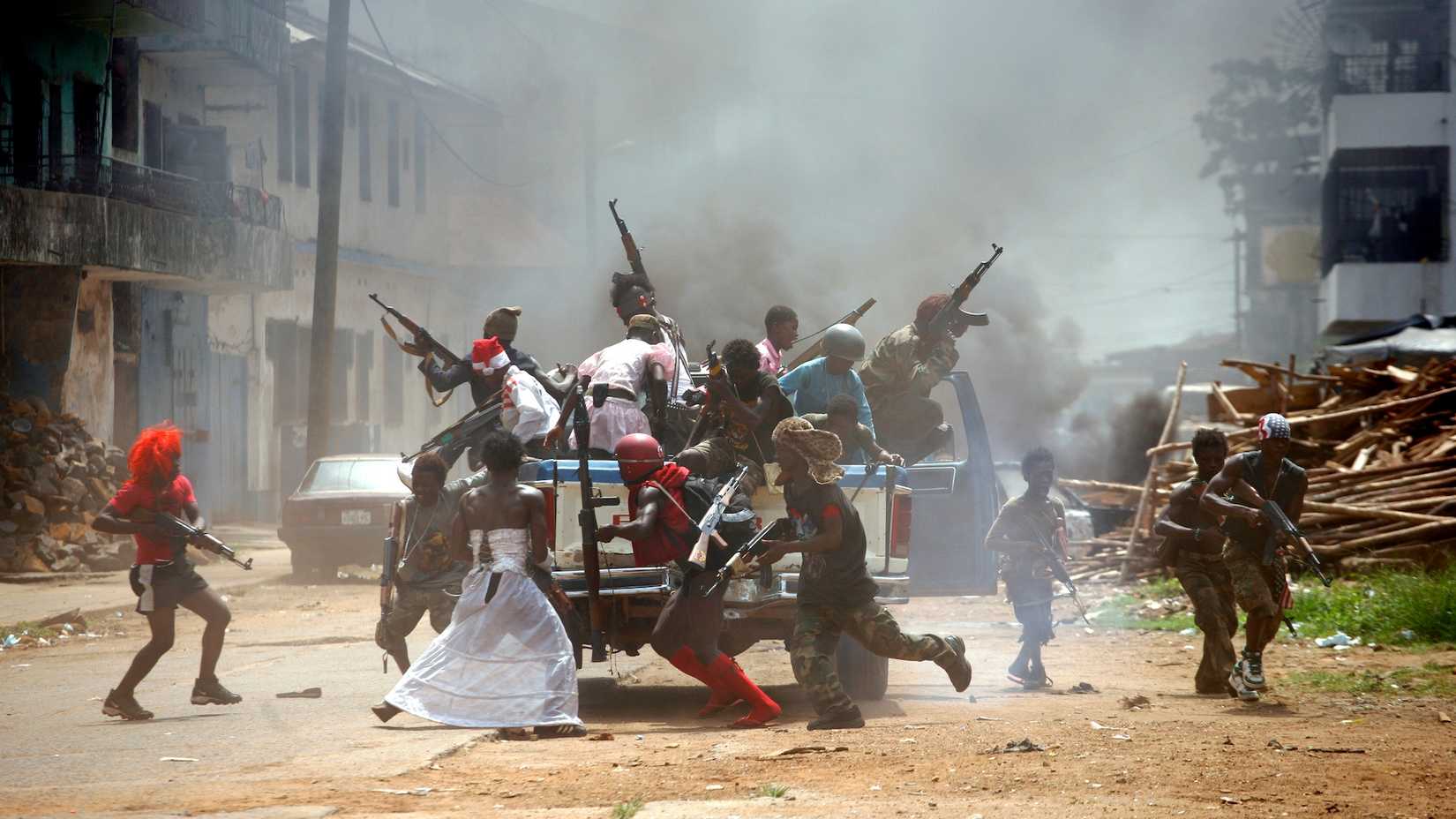 Johnny Mad Dog showing child soldiers on Truck in Africa
