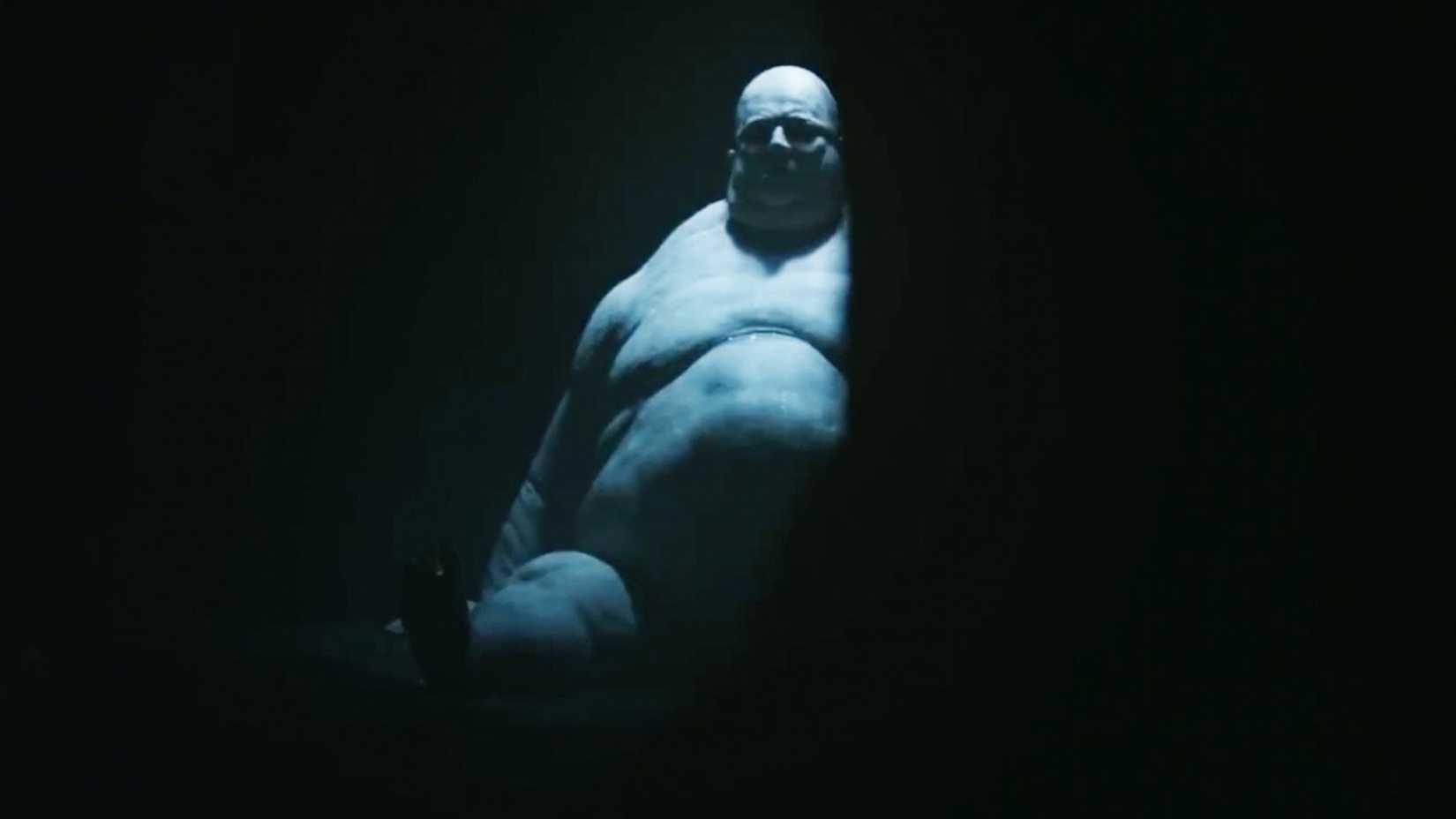monster sitting in darkness in resident evil 2026 trailer