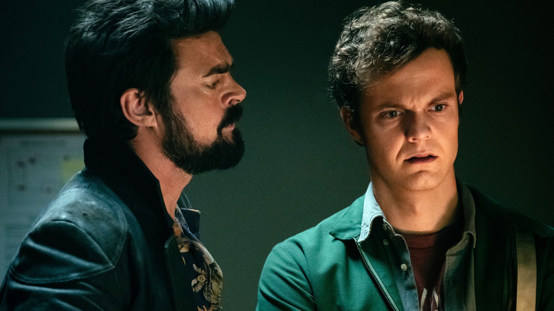 Karl Urban as Butcher looking at Jack Quaid as Hughie in The Boys