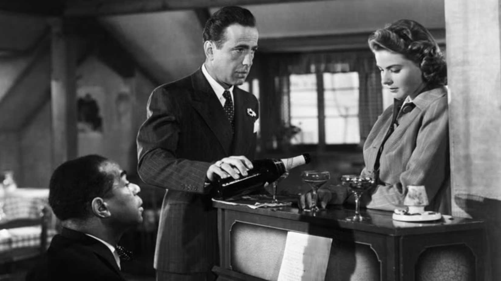 Sam, Rick, and Elsa have a drink in Casablanca