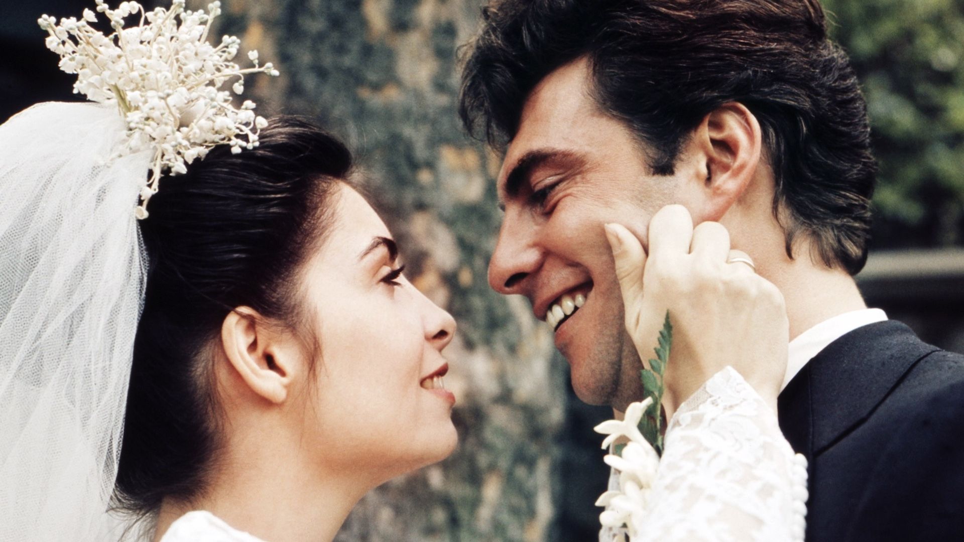 Talia Shire as Michael's sister Connie Corleone and Gianni Russo as her treacherous husband Carlo Rizzi in The Godfather