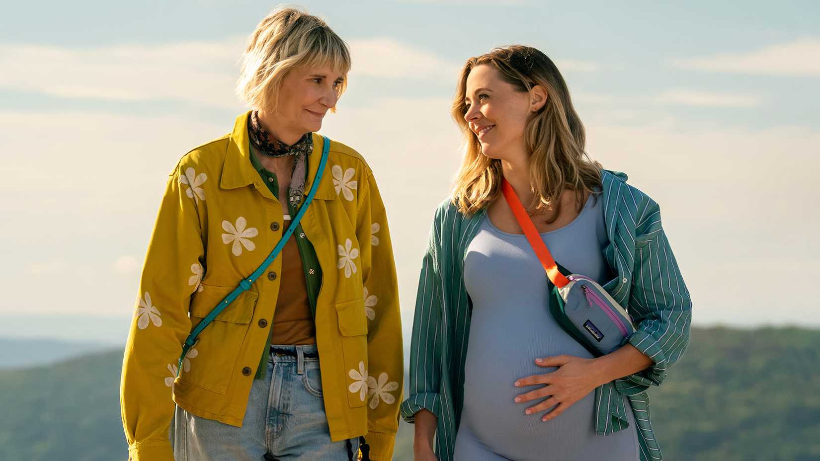 Anne and a pregnant Ginny walking on the beach in The Four Seasons.