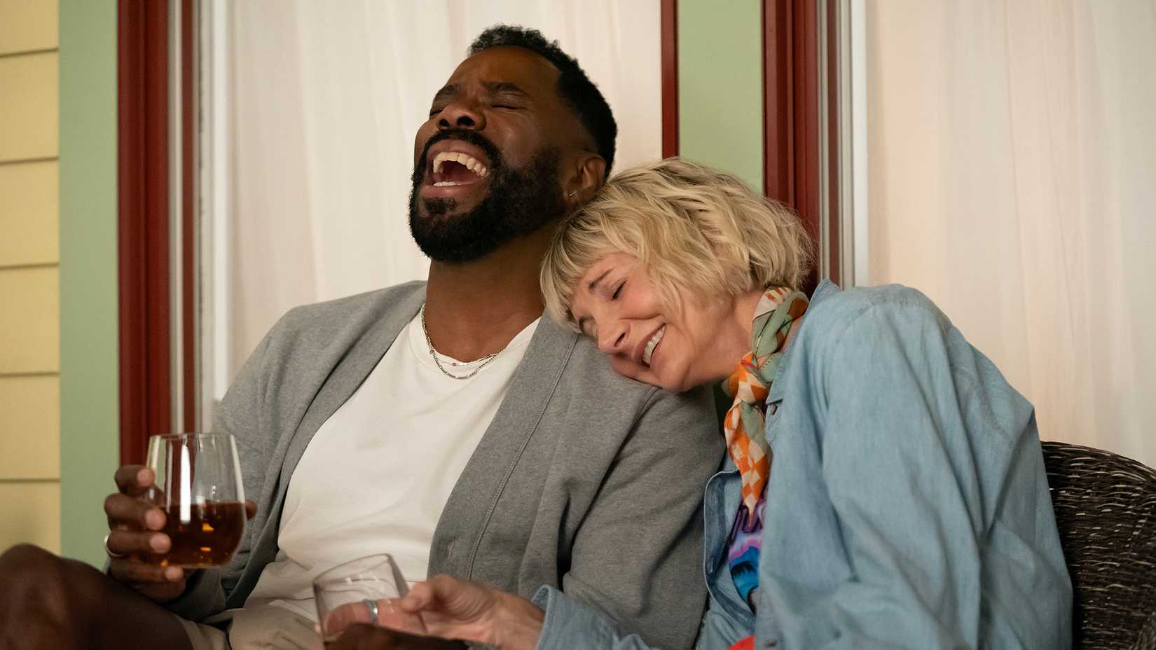 Danny laughing with Anne who has her head on his shoulder in The Four Seasons.