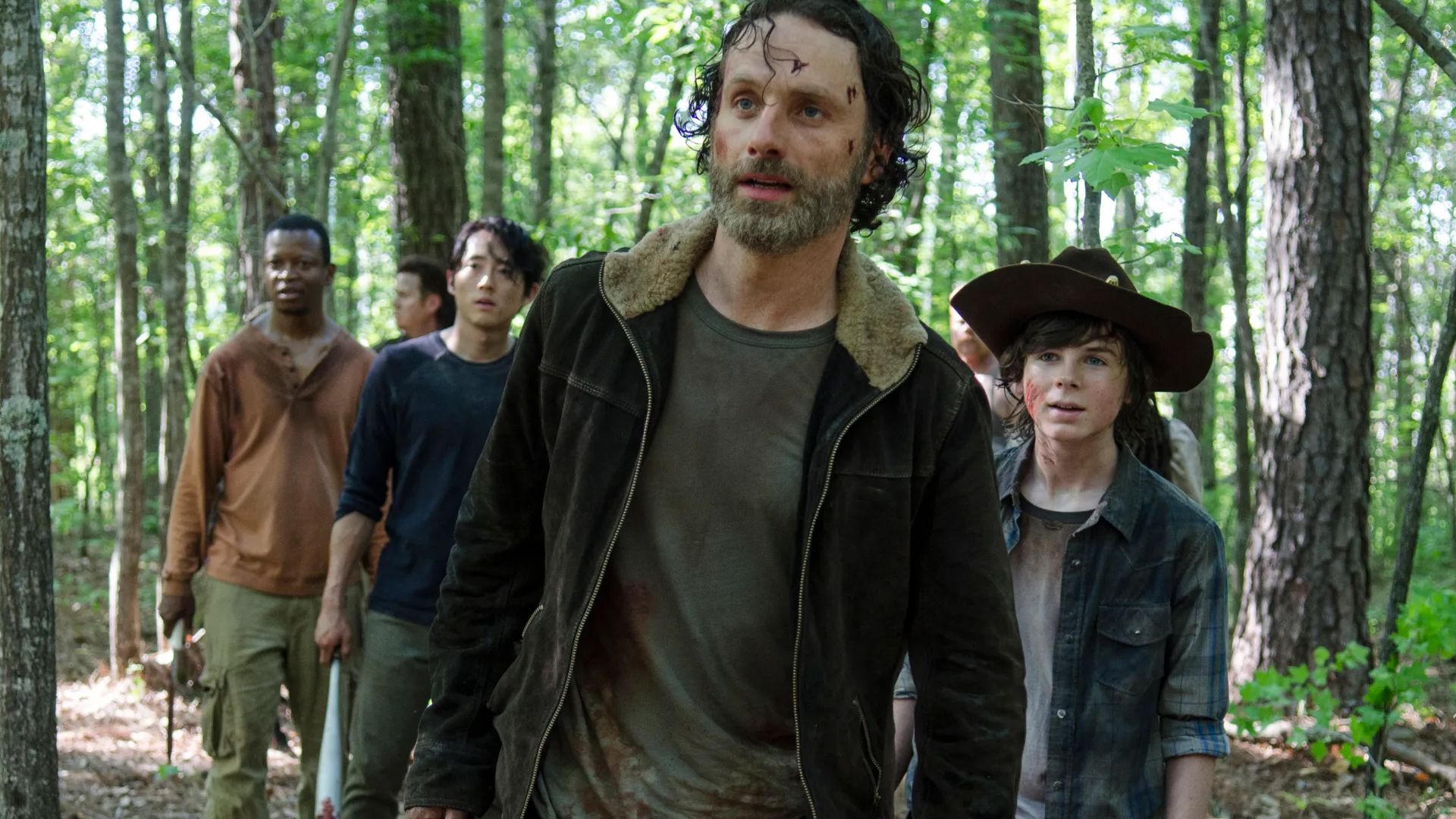 A collage of characters from The Walking Dead series exploring survival themes.