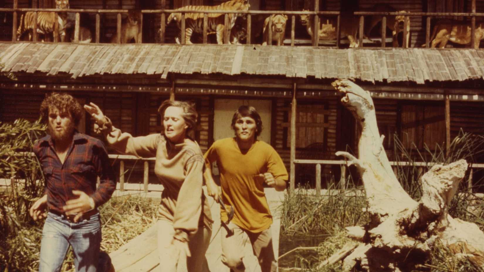 Three people running in Roar (1981)