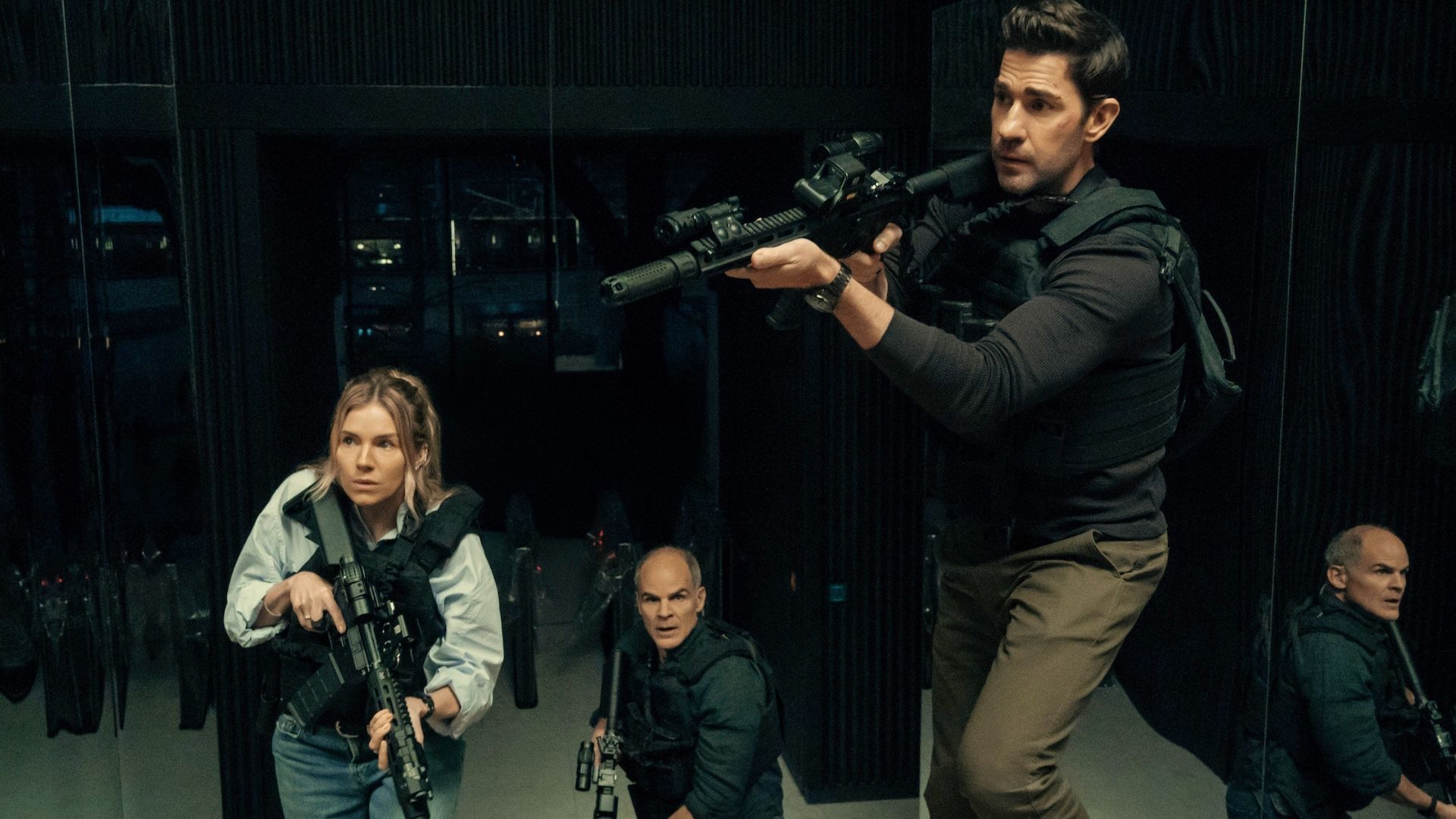 Sienna Miller as Emma Marlow, Michael Kelly as Mike November and John Krasinski as Jack Ryan in Tom Clancy's Jack Ryan: Ghost War