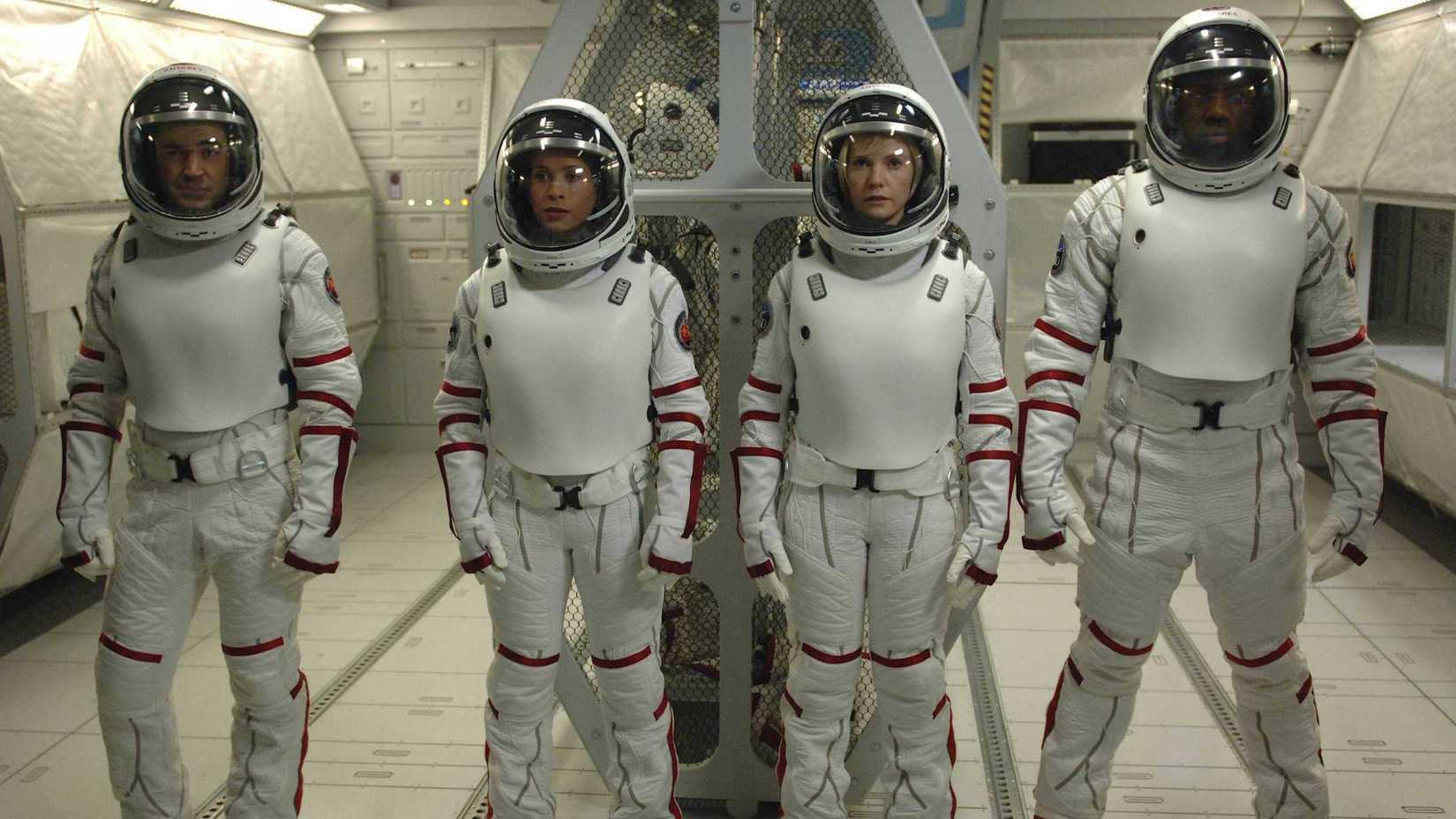 The Antares crew stands together in Defying Gravity