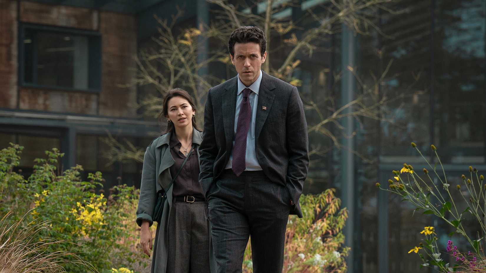 Daniel and Helen walking together in a flashback in Silo.
