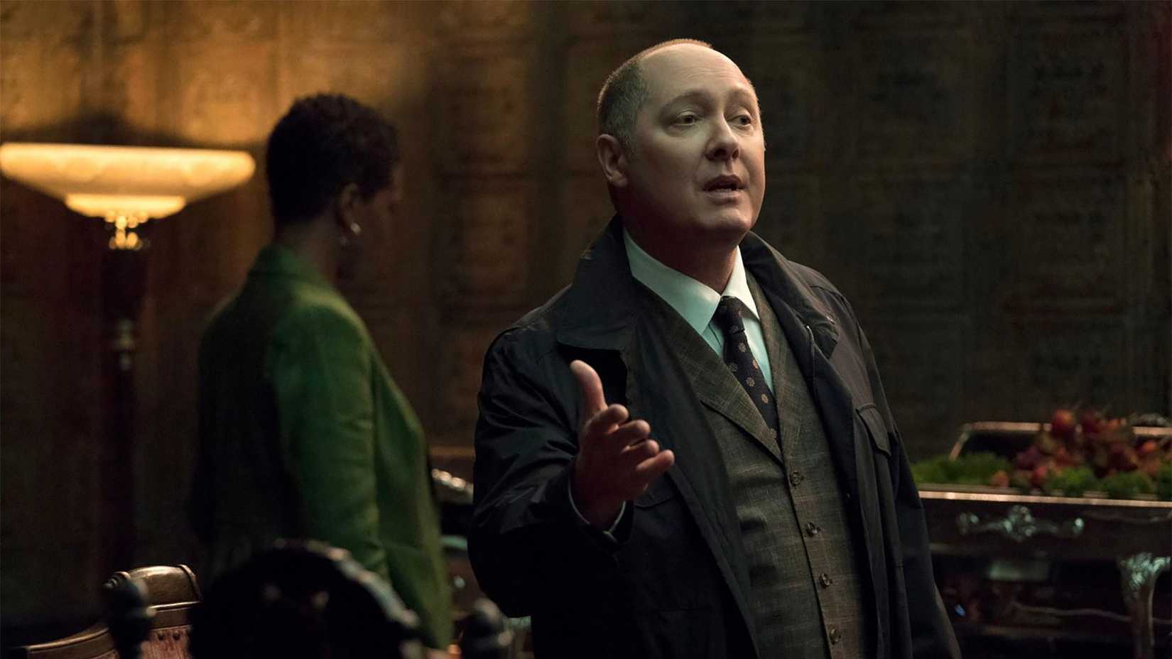 Red holding out his hand talking in The Blacklist.