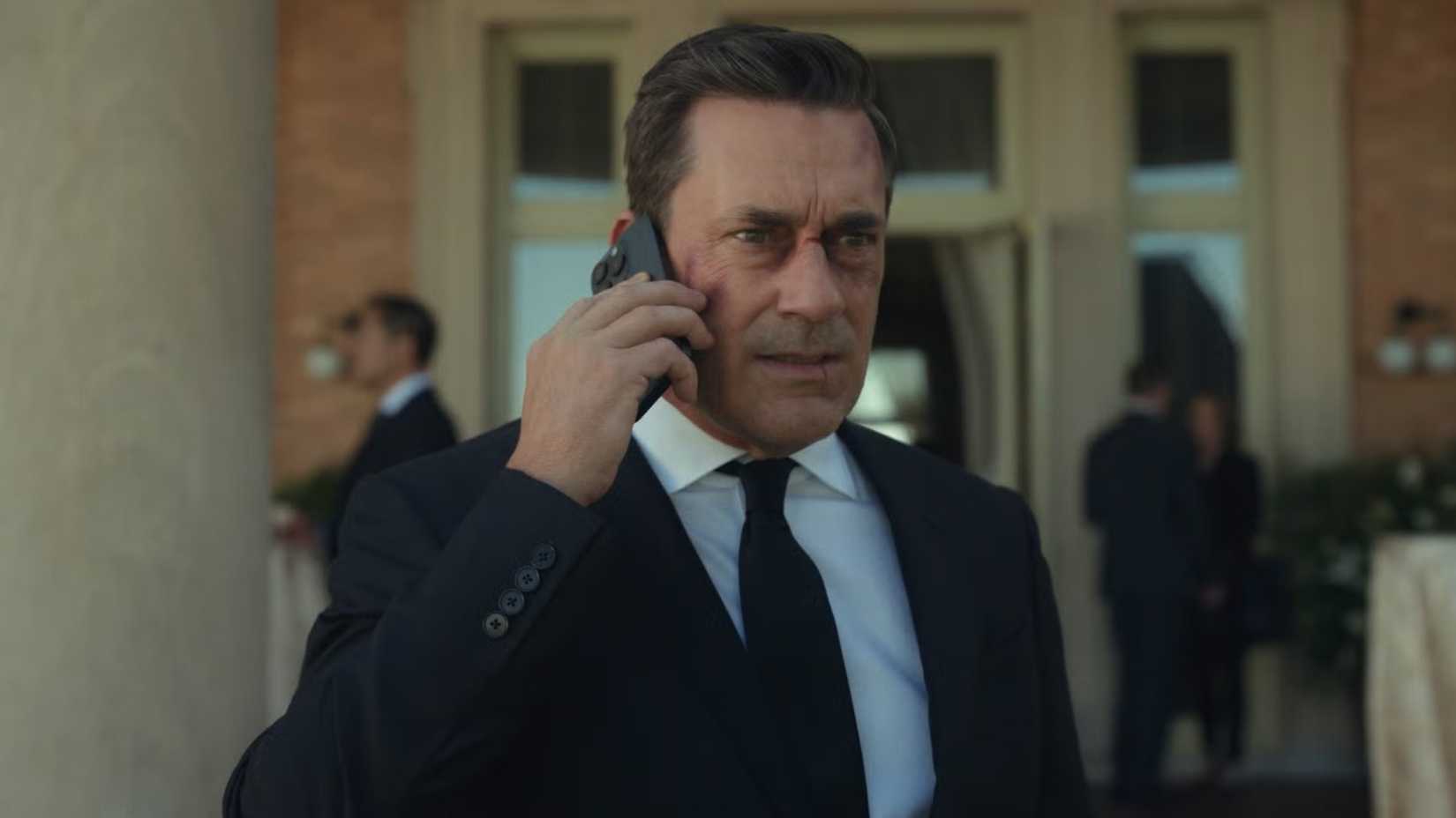 Jon Hamm in Season 1 of Your Friends and Neighbors on the phone with a black eye.