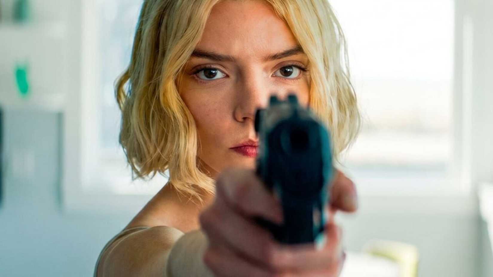 Lucky aims a gun at the camera in Lucky