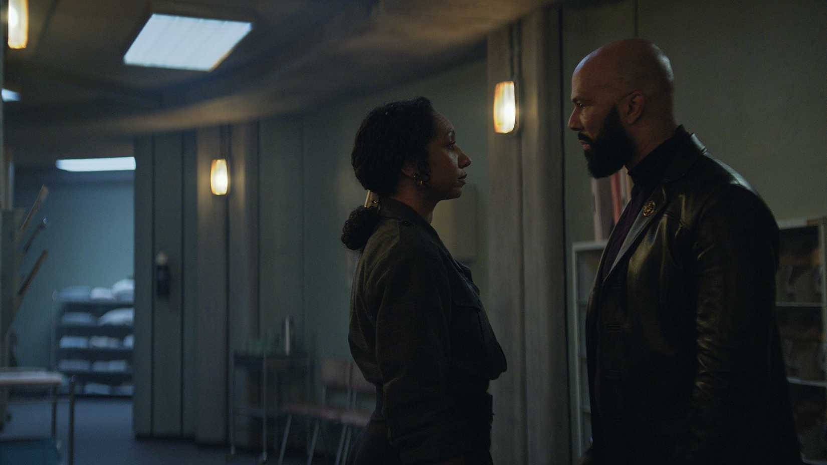 Camille and Sims talking in the hallway in Silo.