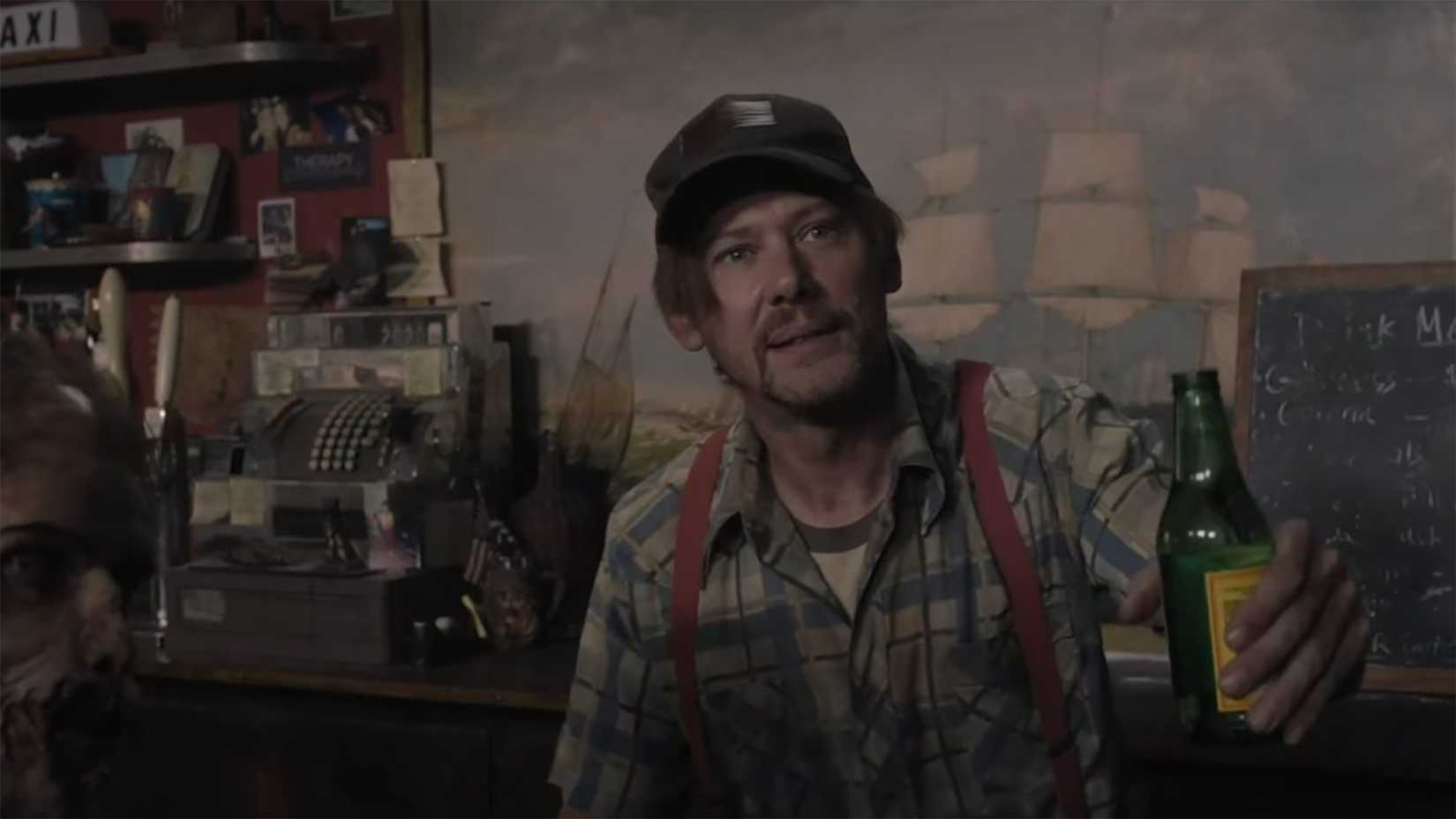Dillard handing Negan a beer at the bar in The Walking Dead: Dead City.