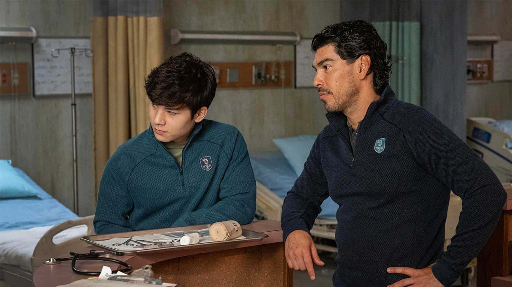 Logan and Luis standing in a hospital in The Walking Dead: Dead City.