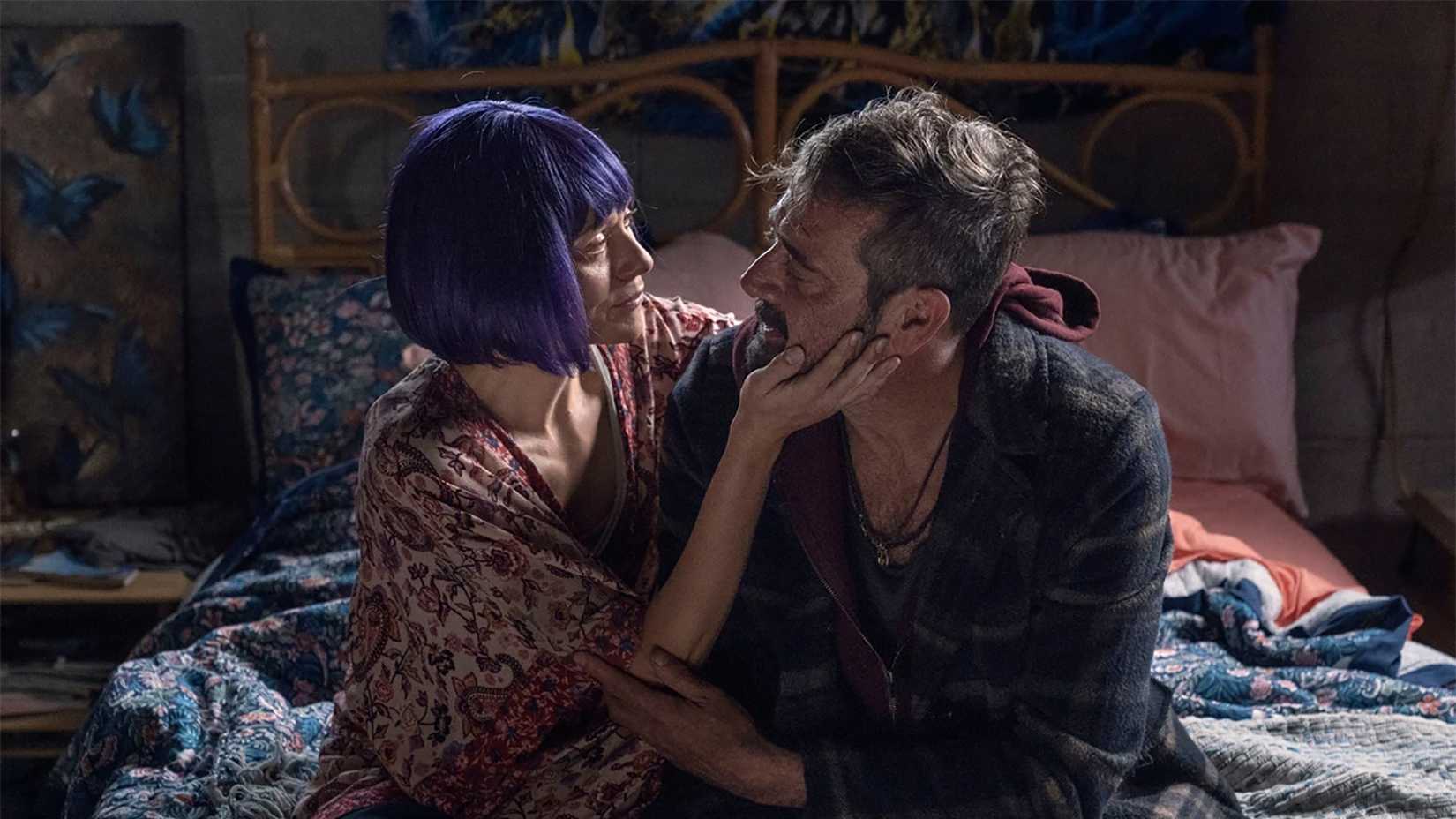 Lucille wearing a purple wig holding Negan's face in the "Here's Negan" episode of The Walking Dead.