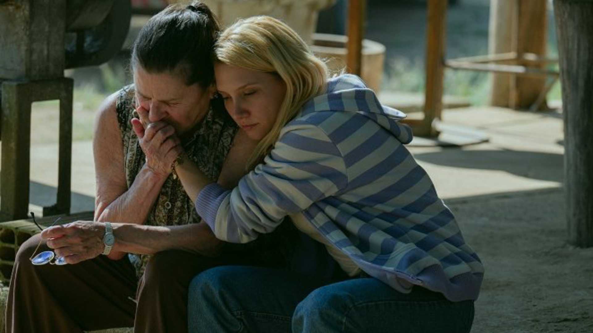Two women hold each other in Elize Shadows of a Woman