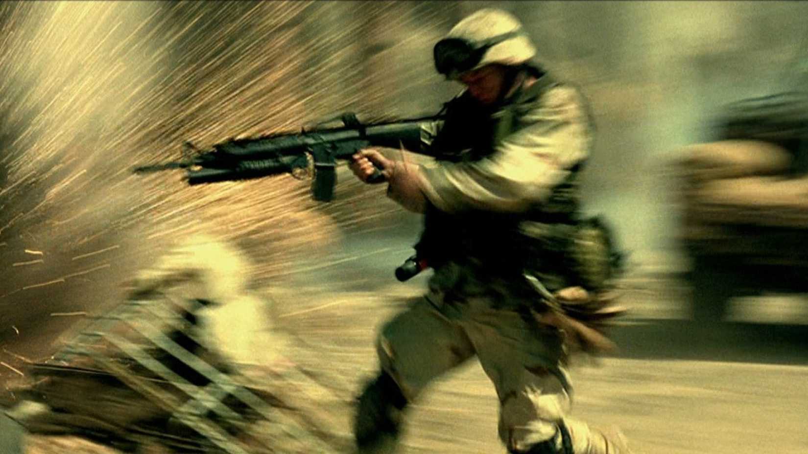 A soldier runs into fire in Black Hawk Down