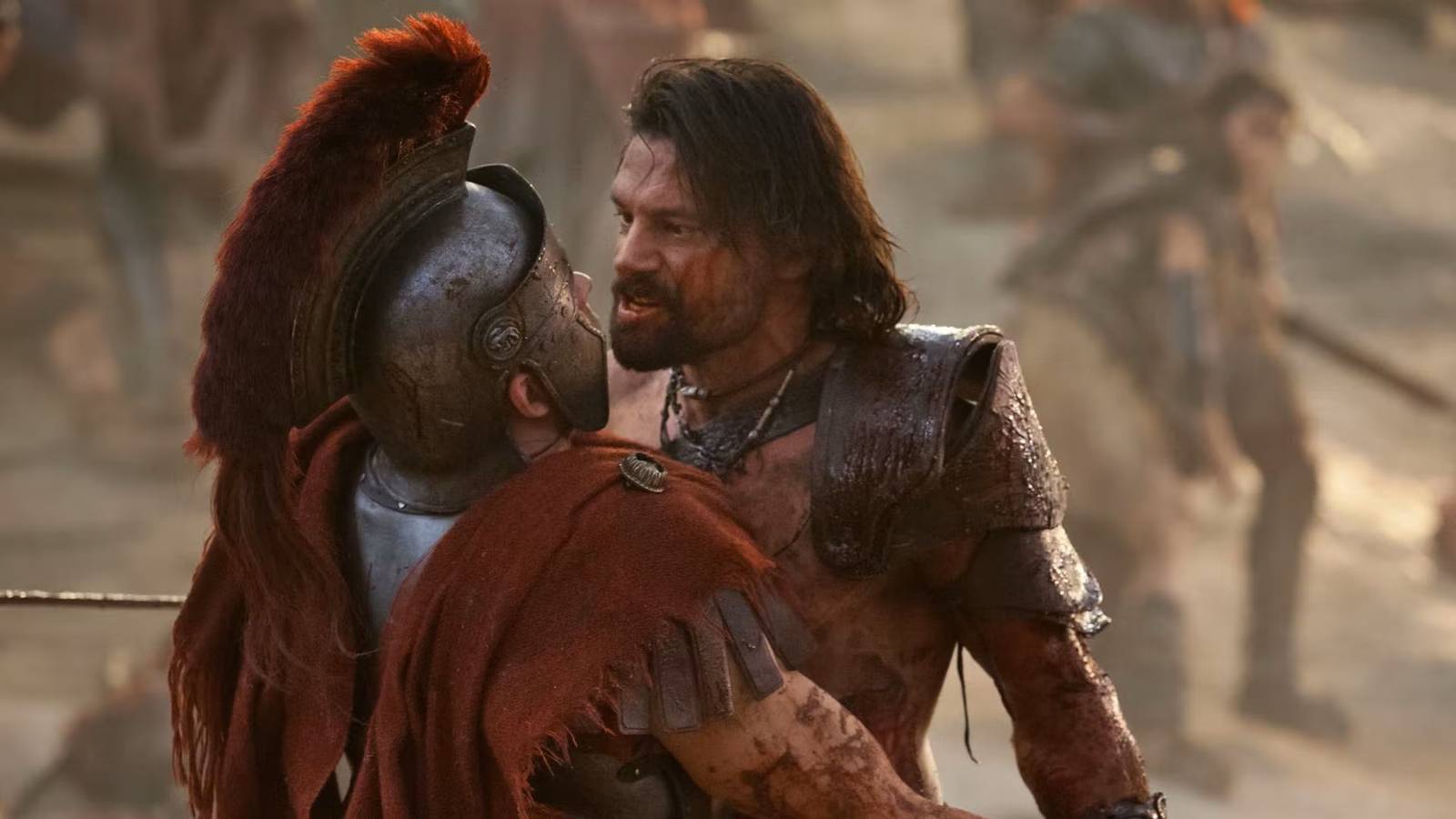A warrior grabs a Roman soldier in Spartacus war of the damned
