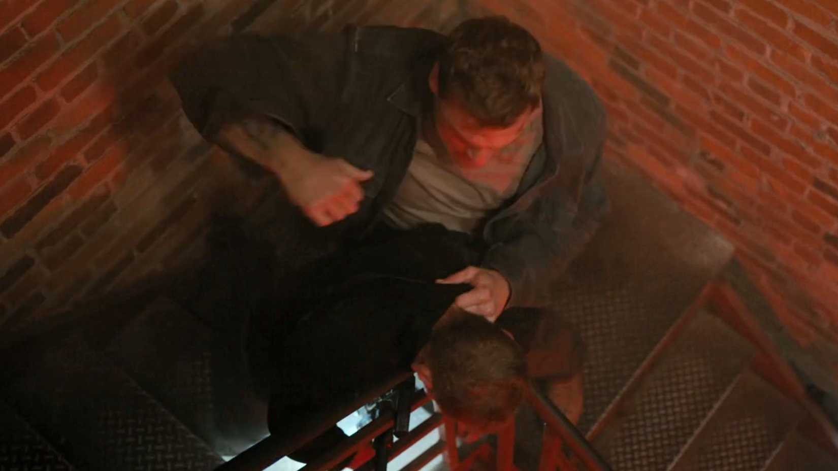 Reacher attacking someone on a staircase in Reacher