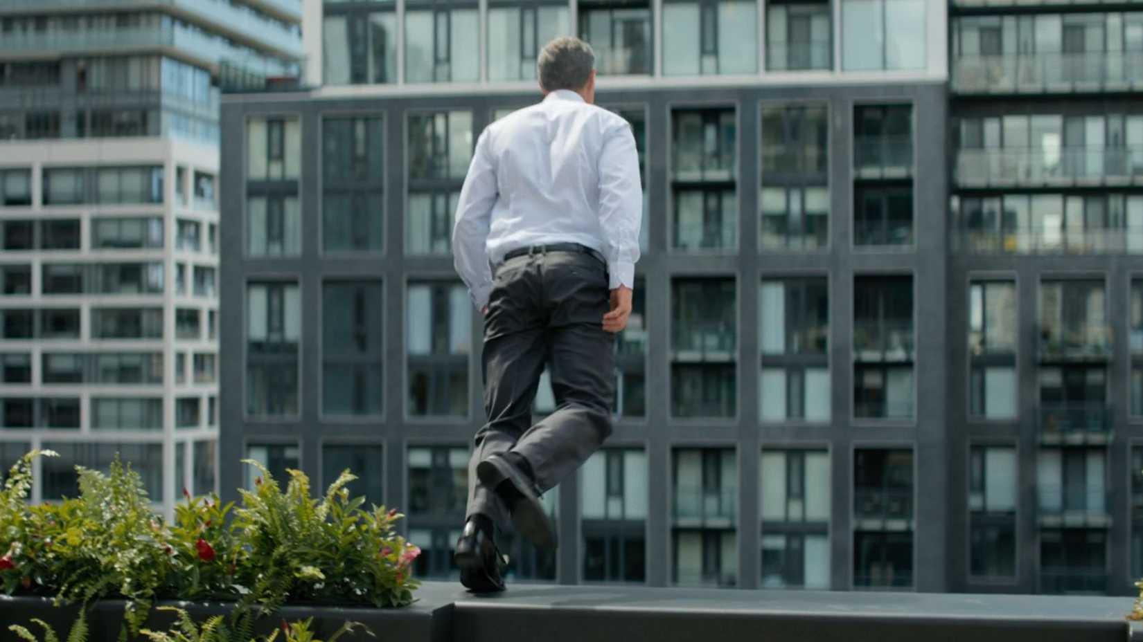 Nolan Cahill jumping from a rooftop in Reacher