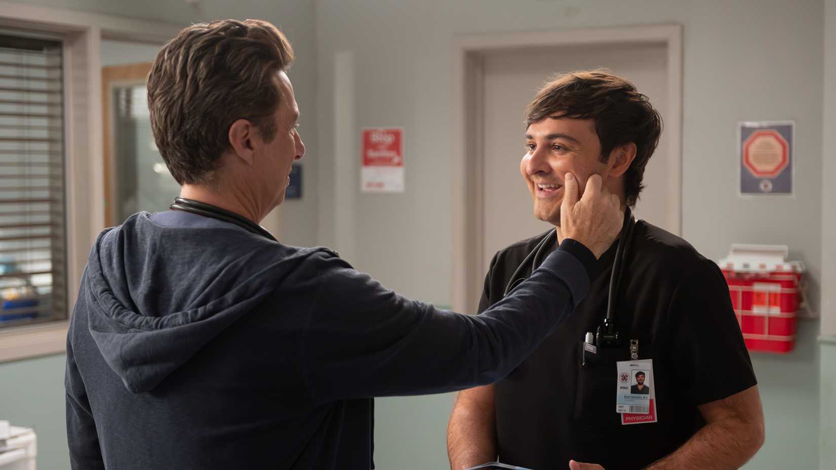 JD reaching out and squeezing Grant's cheek in Scrubs revival season 2.