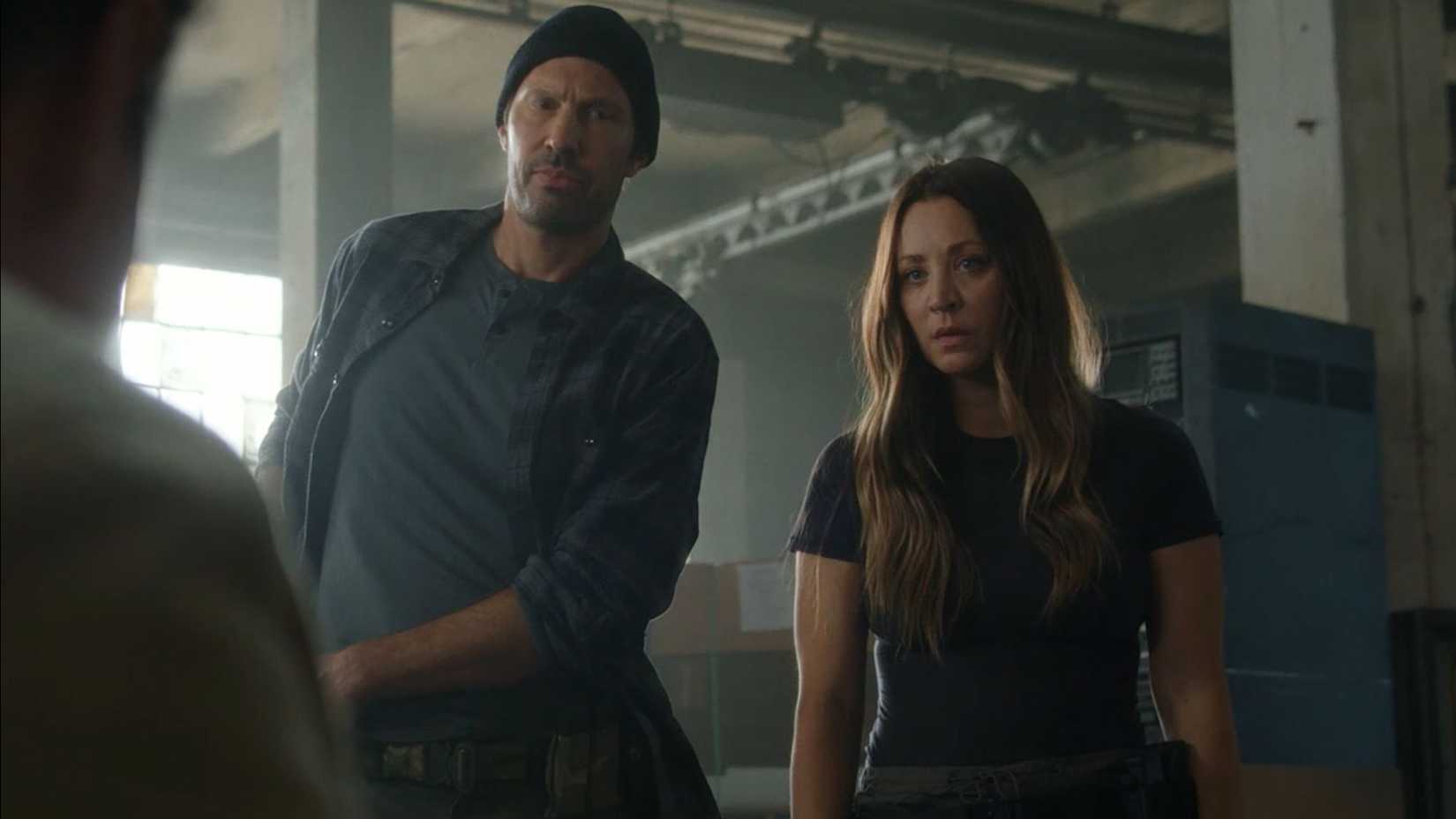 Brian Thomas Smith as Zack and Kaley Cuoco as Penny looking intimidating as they talk to Stuart in Stuart Fails to Save the Universe.