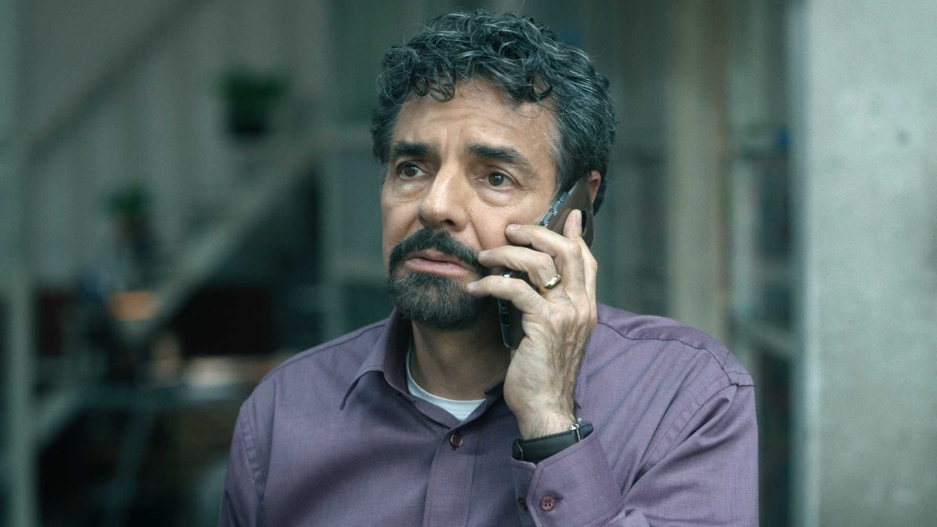 eugenio Derbez uses a phone in The Trial