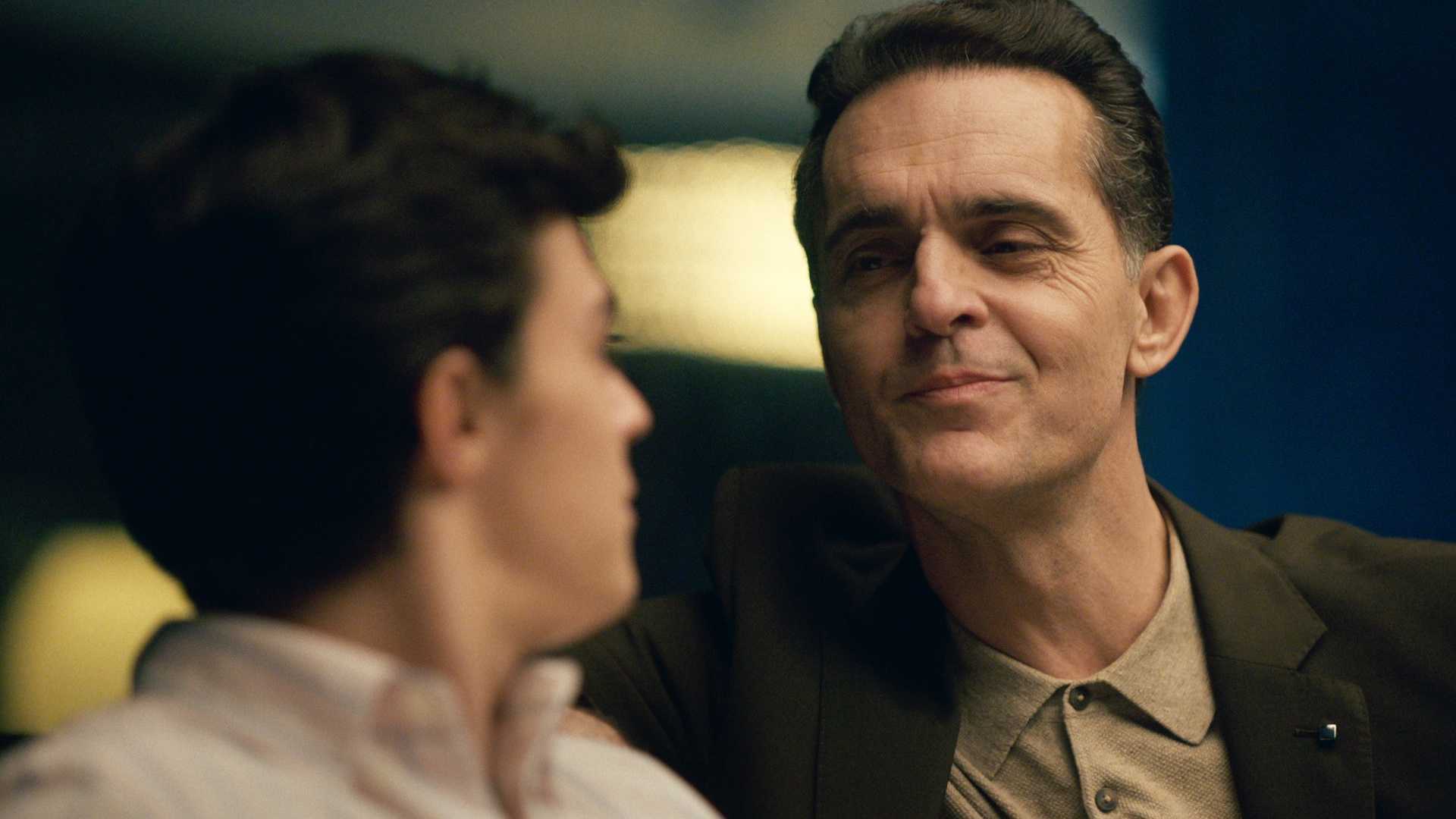 Pedro Alonso talks to a teen in the Trial