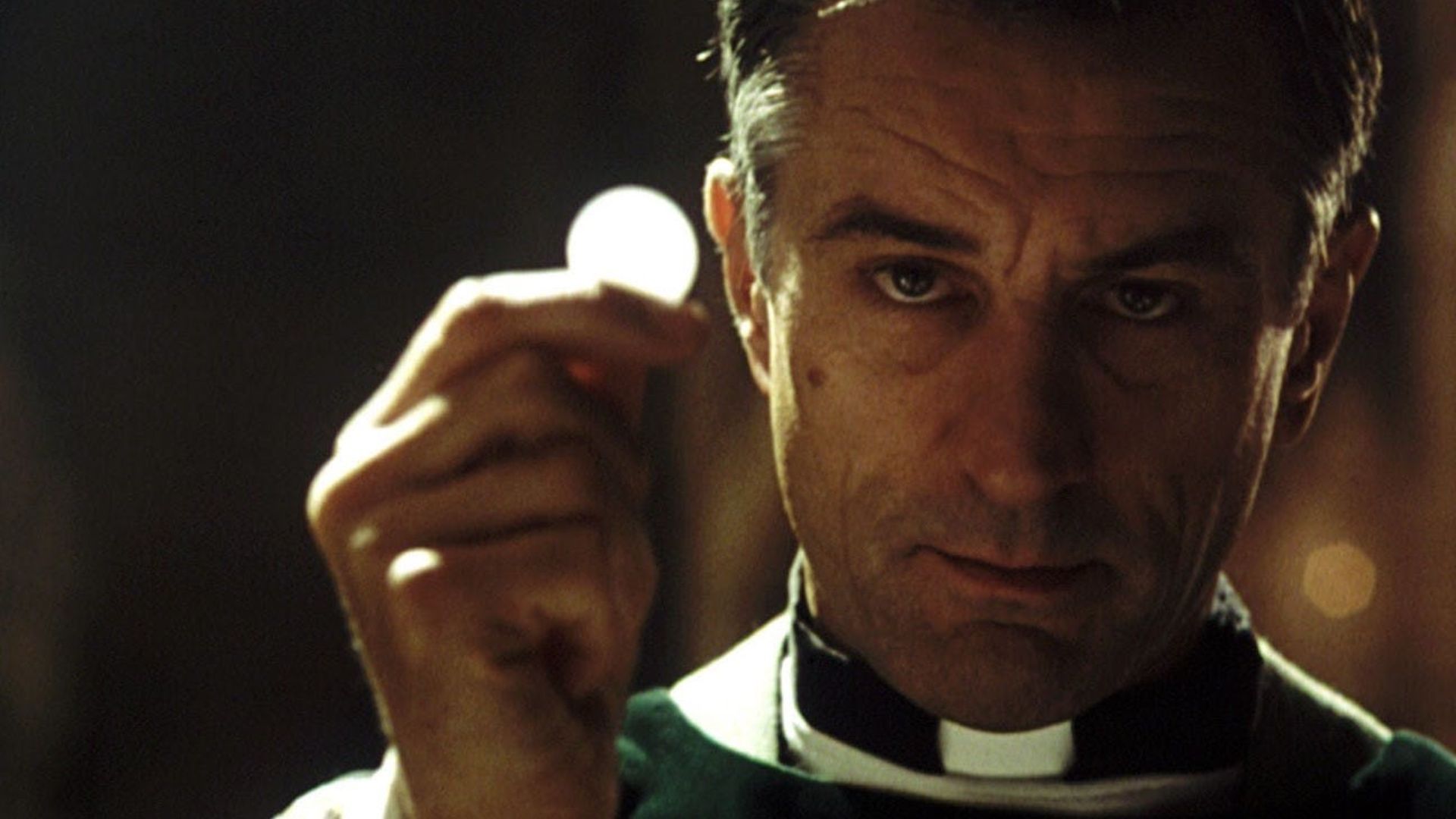 Robert De Niro is a priest in the film Sleepers
