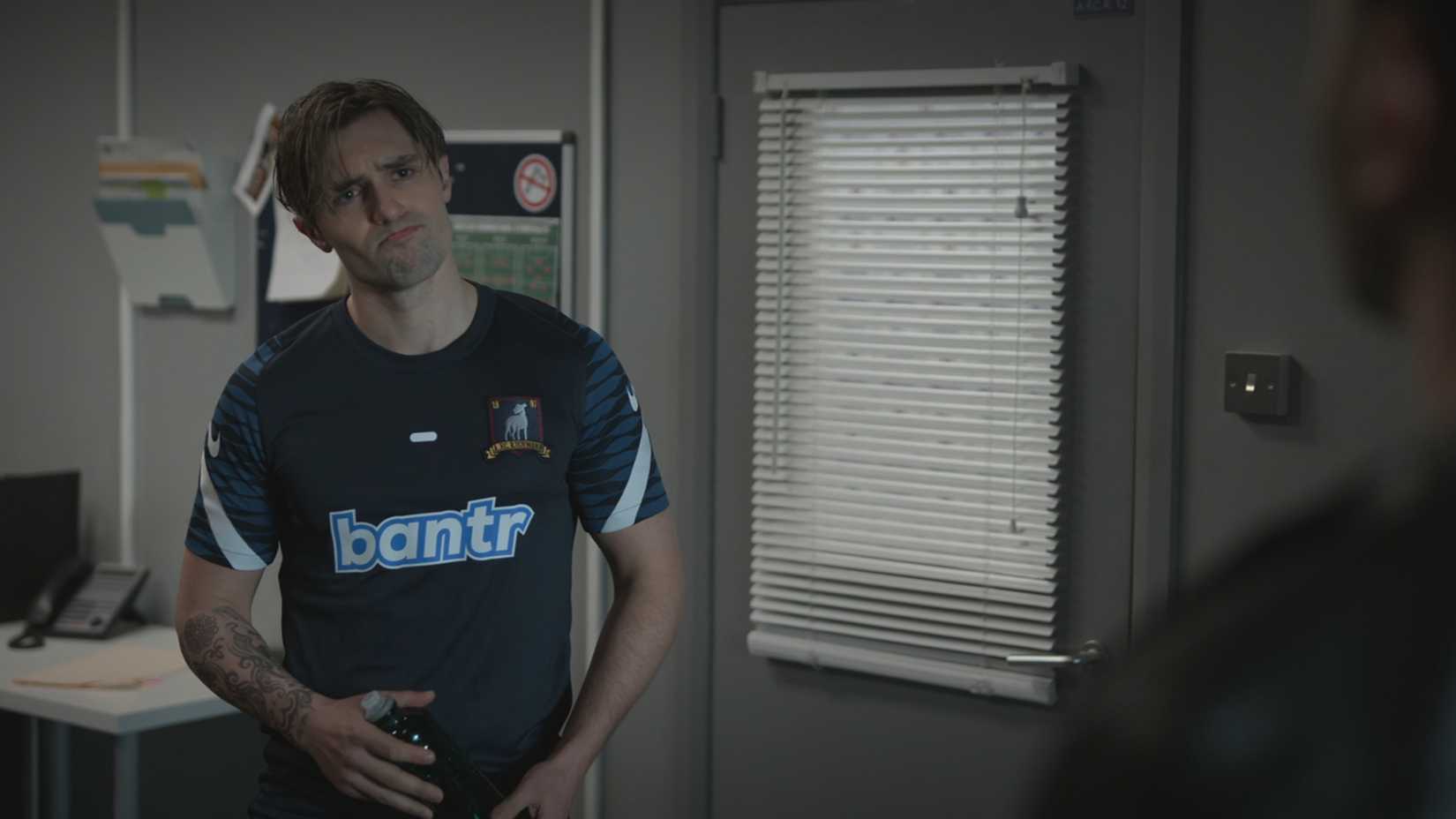 Jamie trying to look empathetic while talking to Roy about his breakup with Keeley in Ted Lasso.