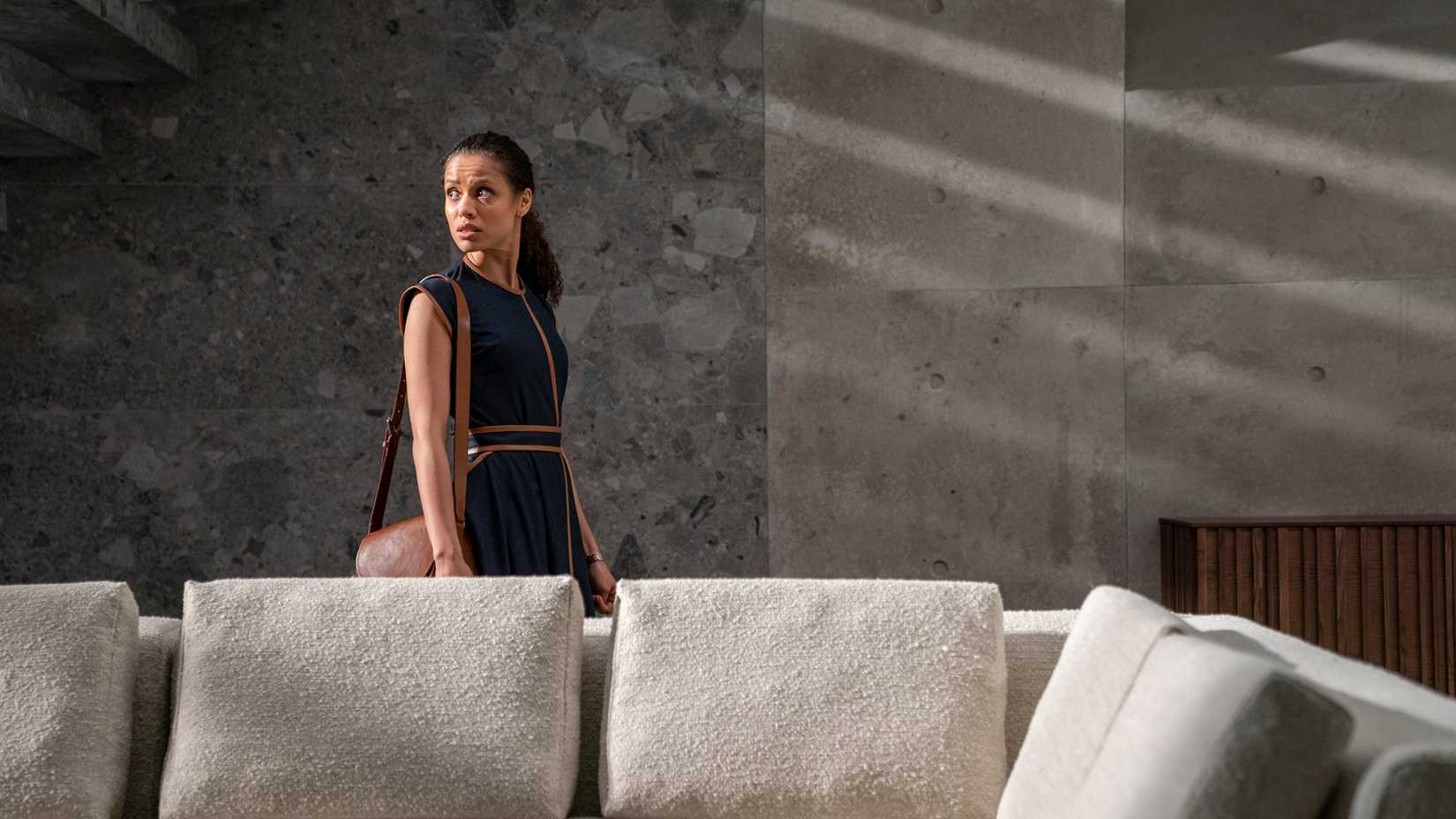 Gugu Mbatha-Raw as Jane Cavendish looking anxiously around a large house in The Girl Before.