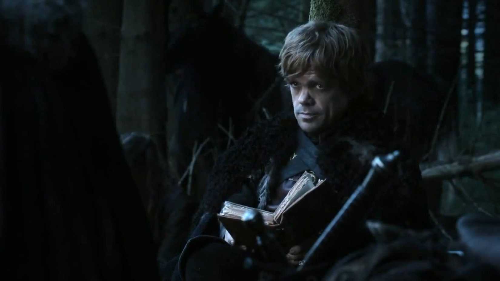 Tyrion holding a book in 'Game of Thrones'