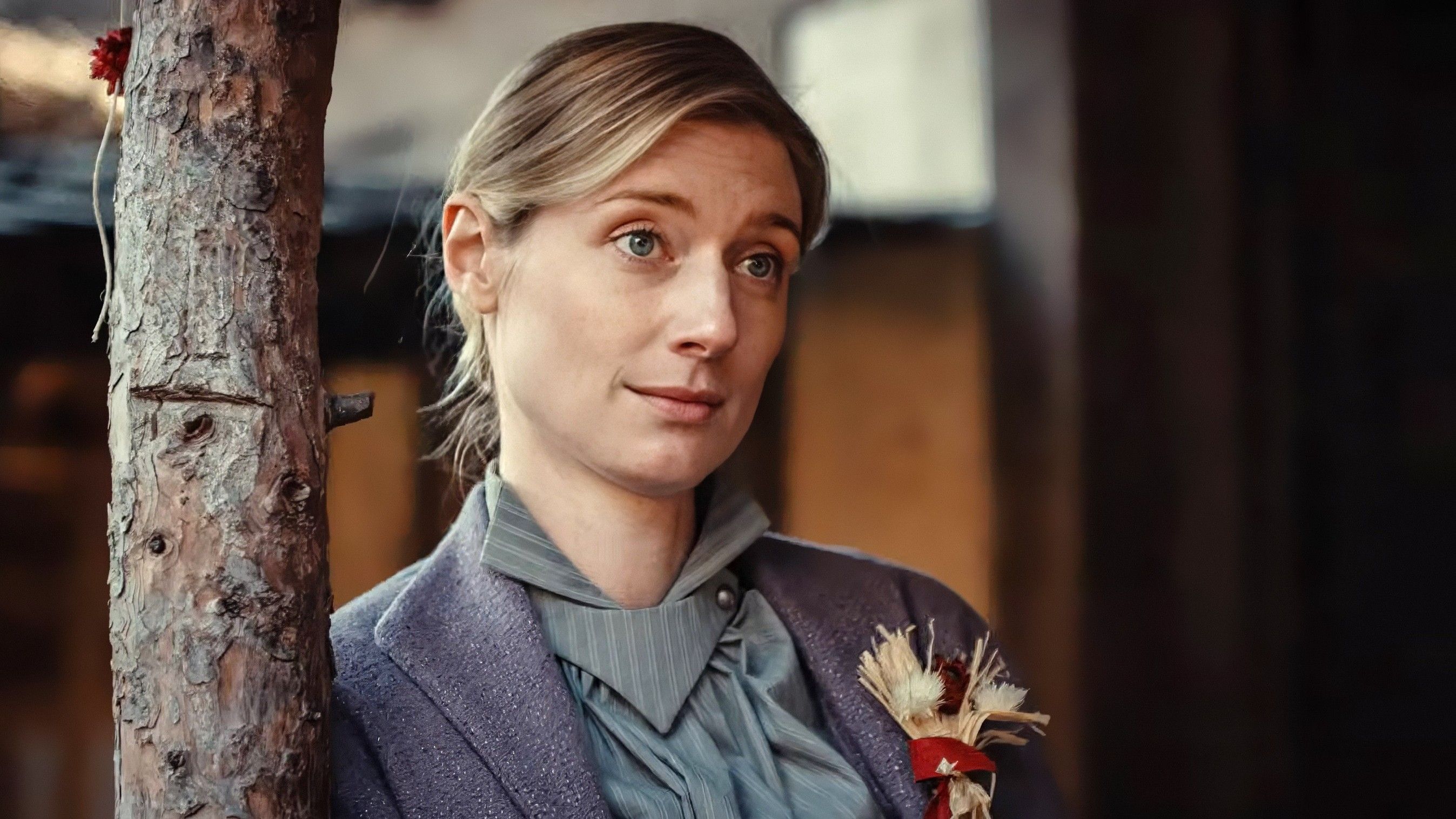 Elizabeth Debicki as the Tailor's Wife Leaning Against A Support Beam In Wicker