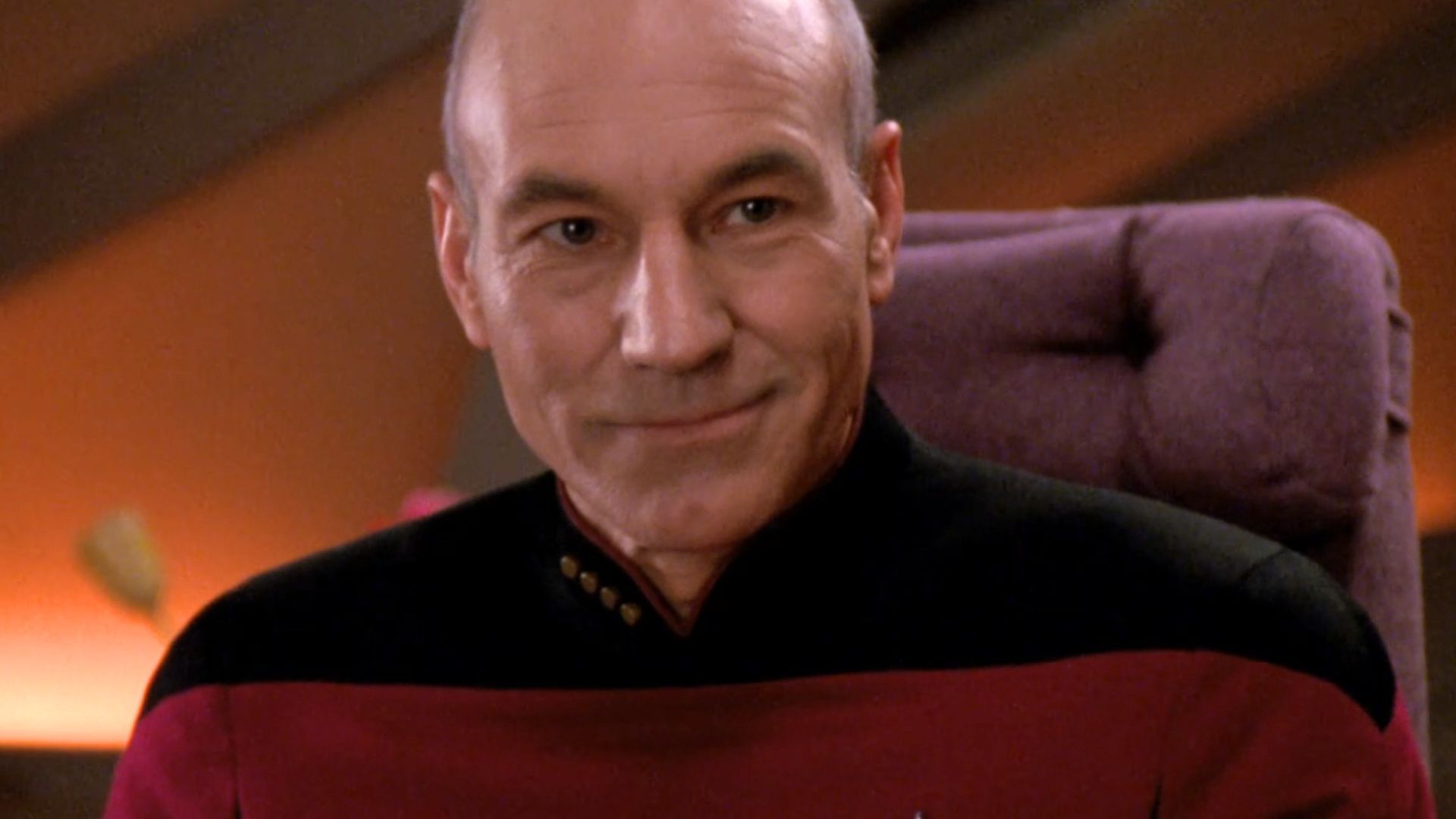 Patrick Stewart smiling as Captain Jean-Luc Picard in Star Trek: The Next Generation
