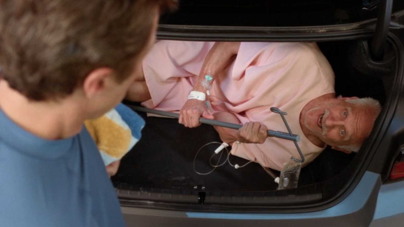 JD looking at a patient in his trunk in Scrubs