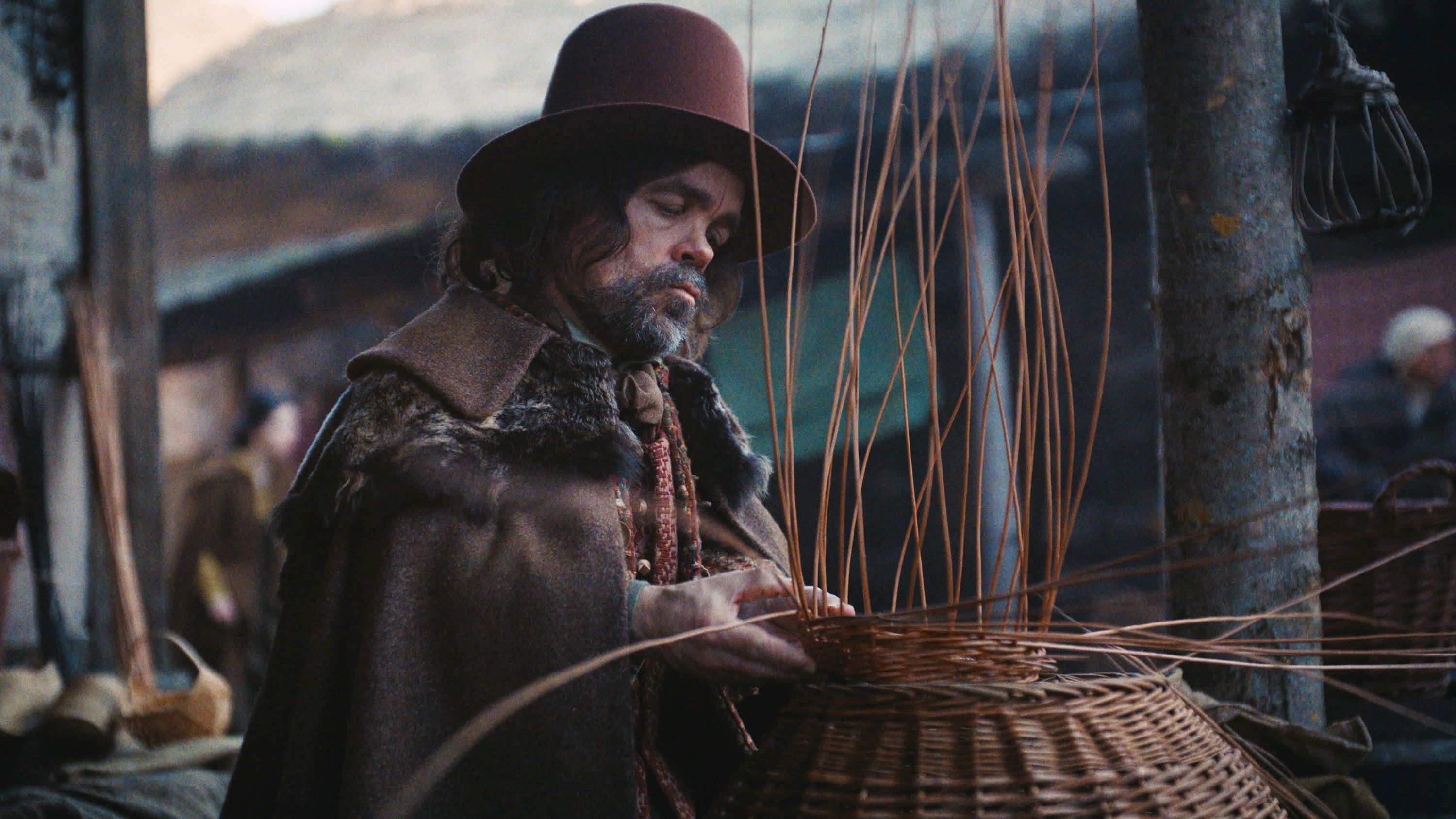 Peter Dinklage as the Basket Weaver weaving a wicker basket in Wicker