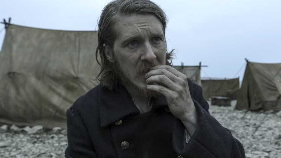 A man bites his nails in The Terror